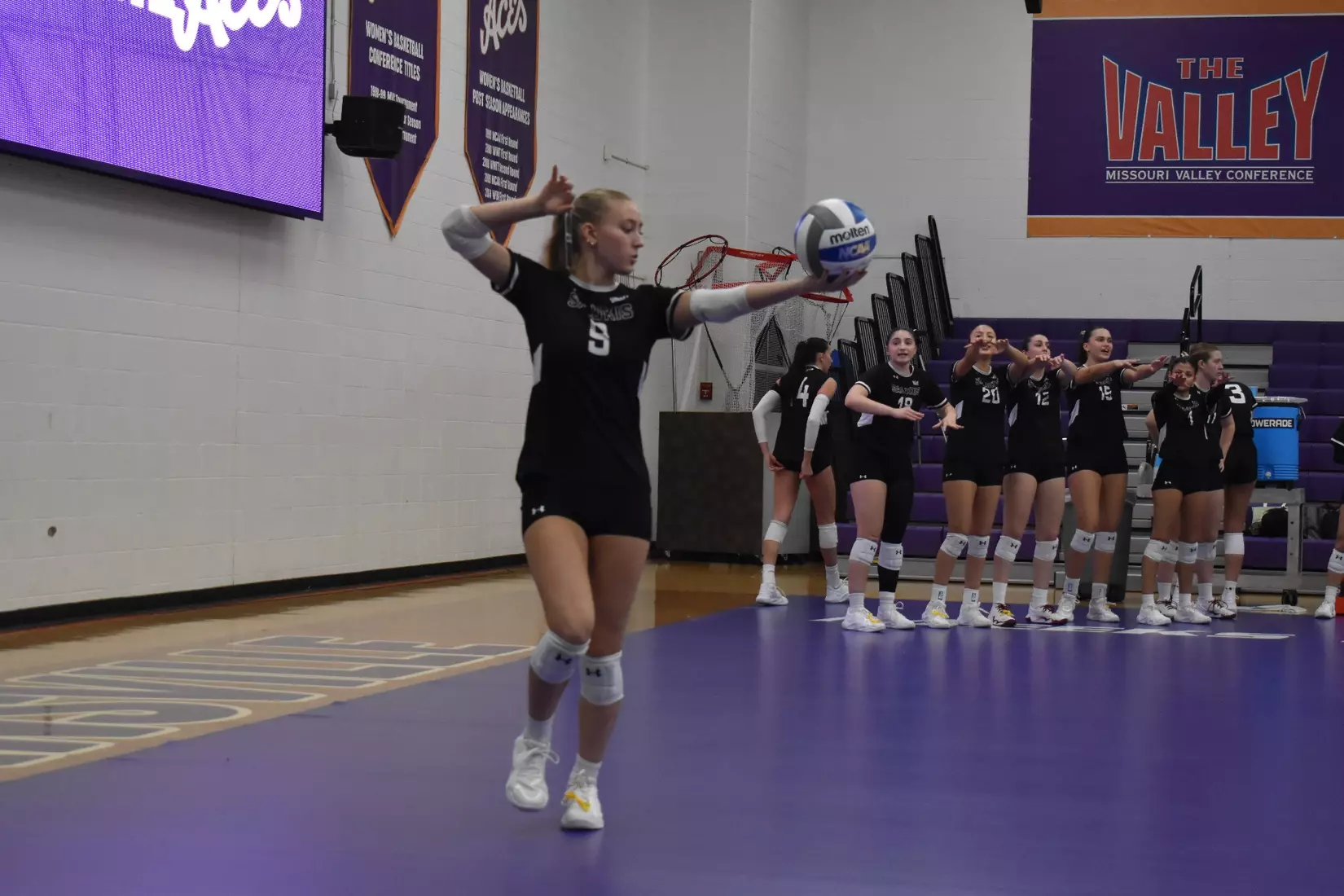 Lillian Dempkey prepares for a serve.