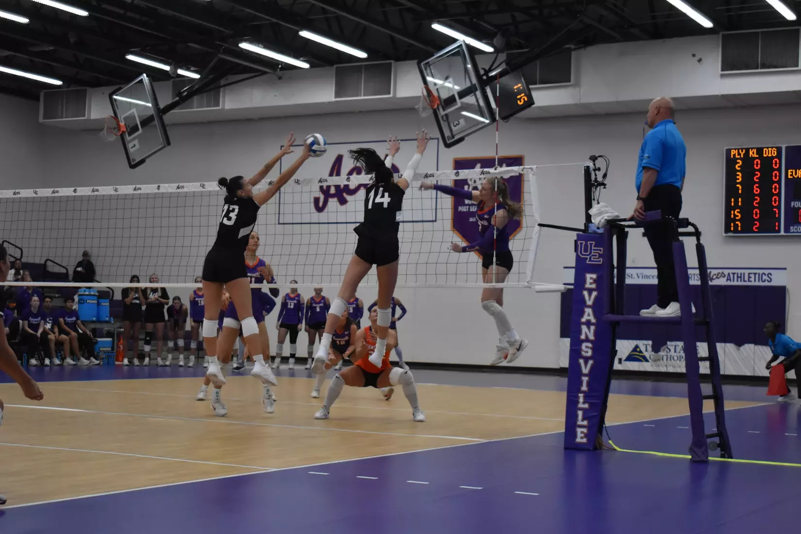 Beatriz Piaia and Ella Swansiger go up for a block attempt.