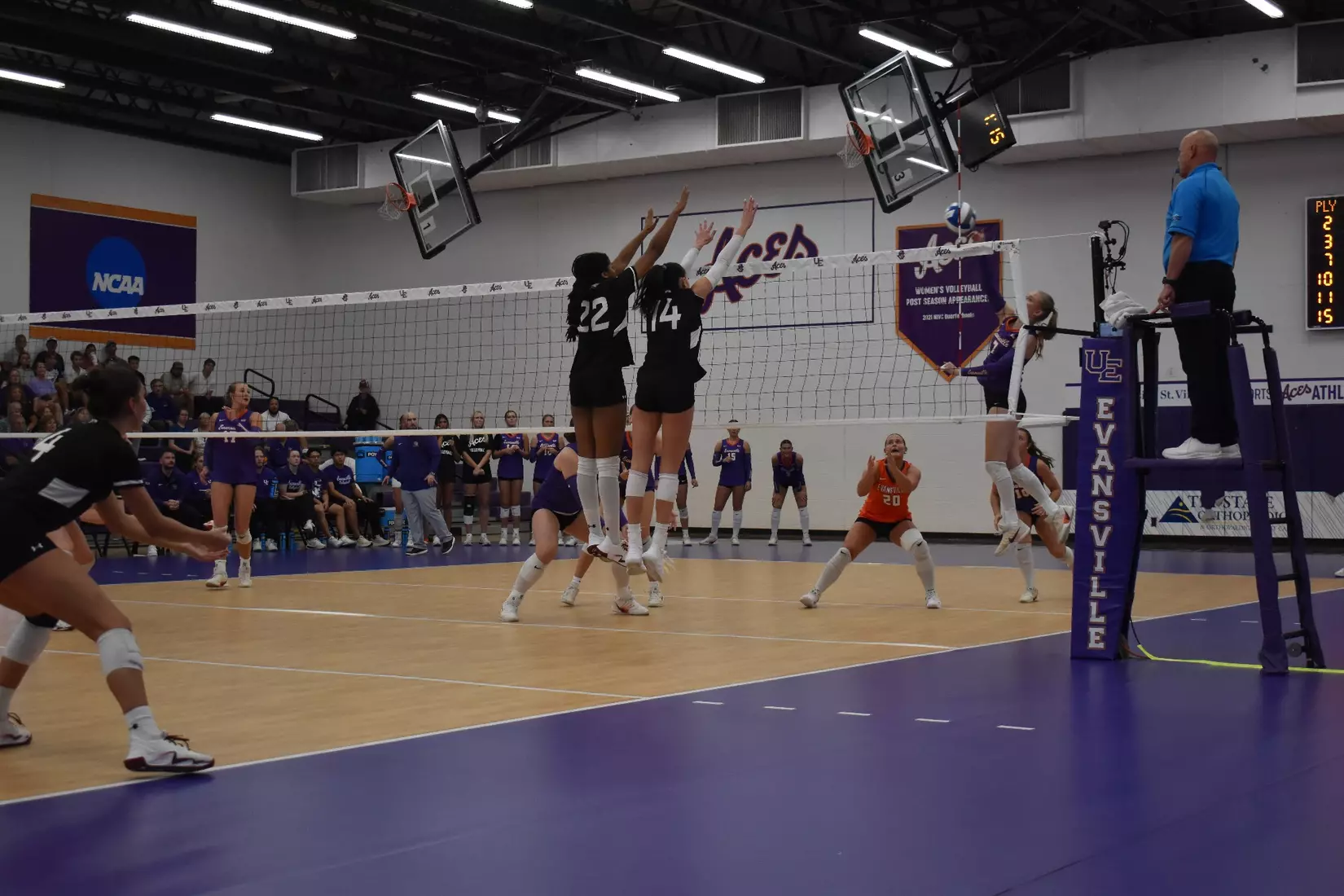 Chloe Anderson and Ella Swansiger go up for a block attempt.