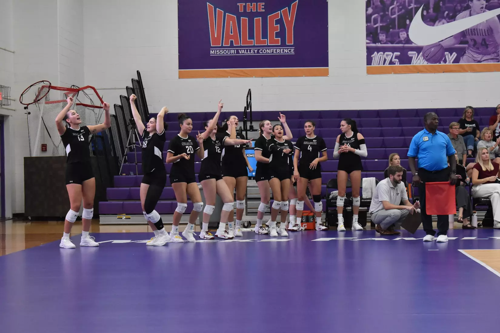 The bench celebrates after a point.