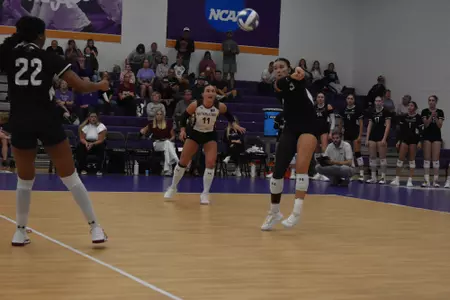 McKenzie Moeller receives a serve.