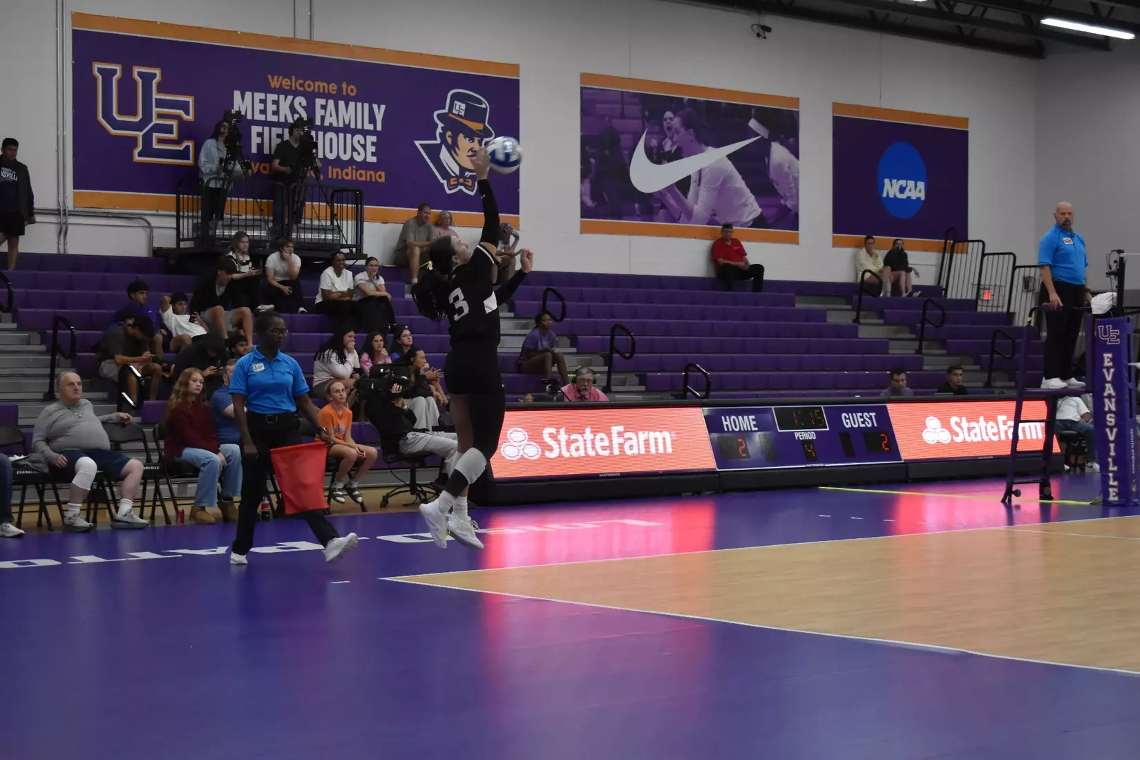 McKenzie Moeller serves a ball in the match.