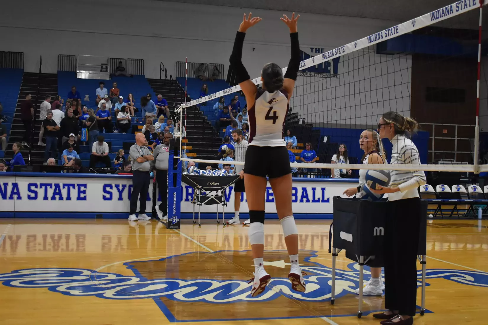 Ella McFarland sets a ball.