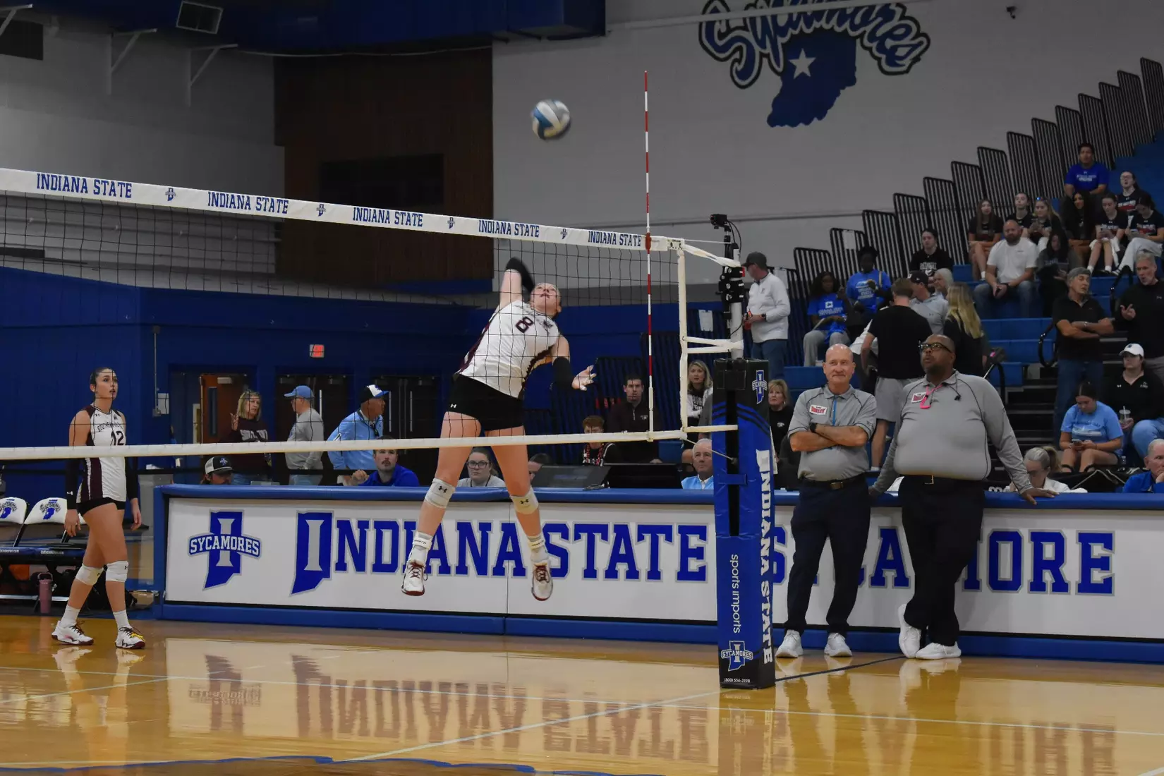 Alexandria Arrington attacks a ball in warmups.