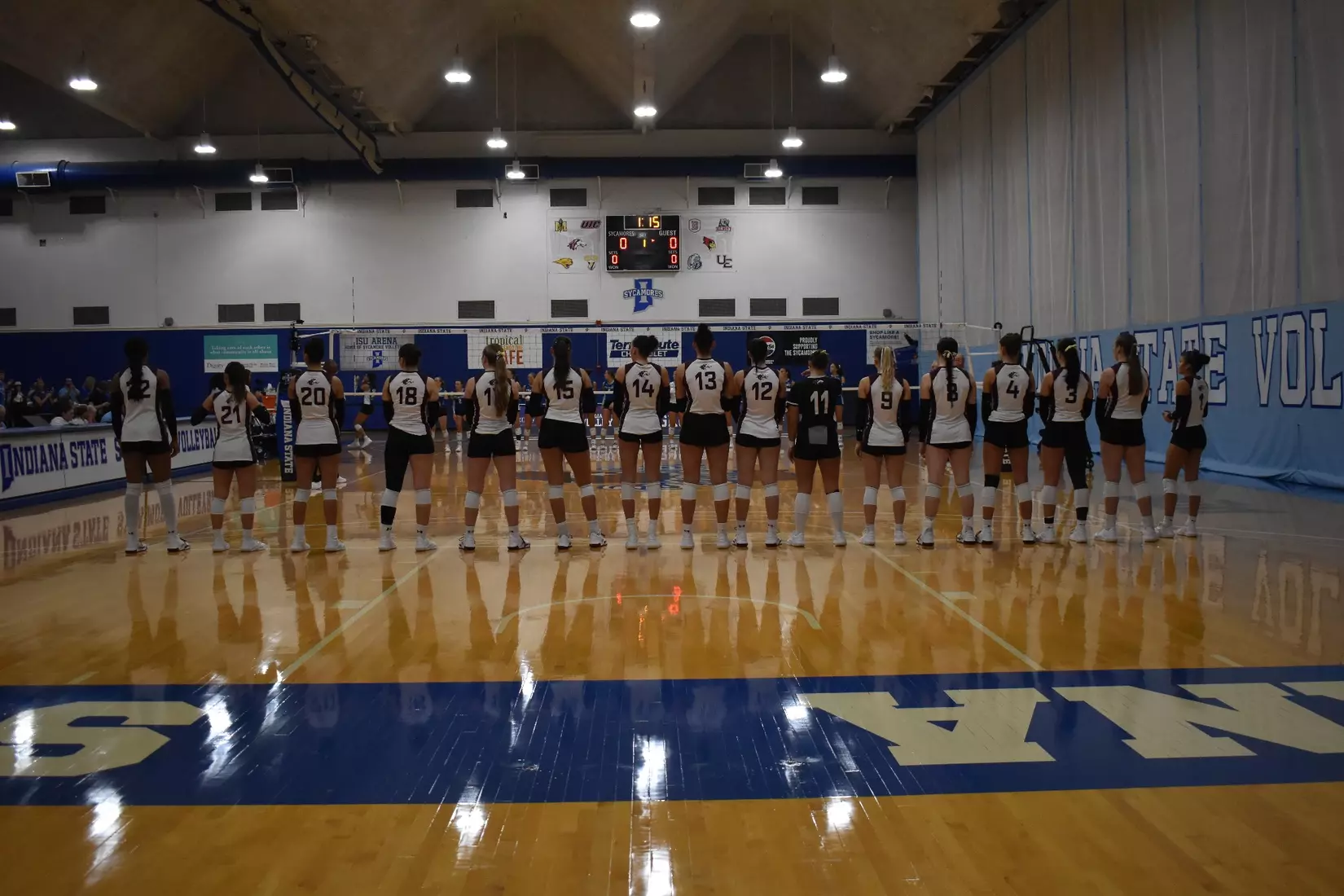 The team watches on during opposing introductions.