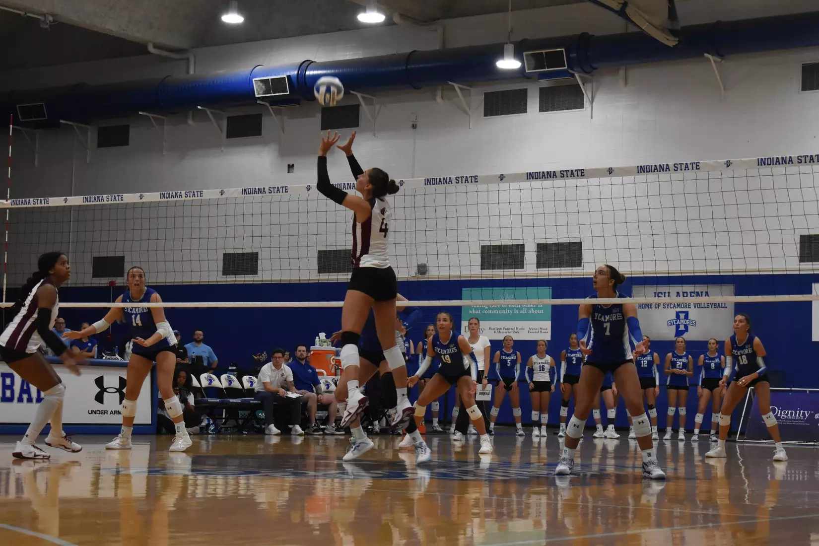 Ella McFarland sets a ball.