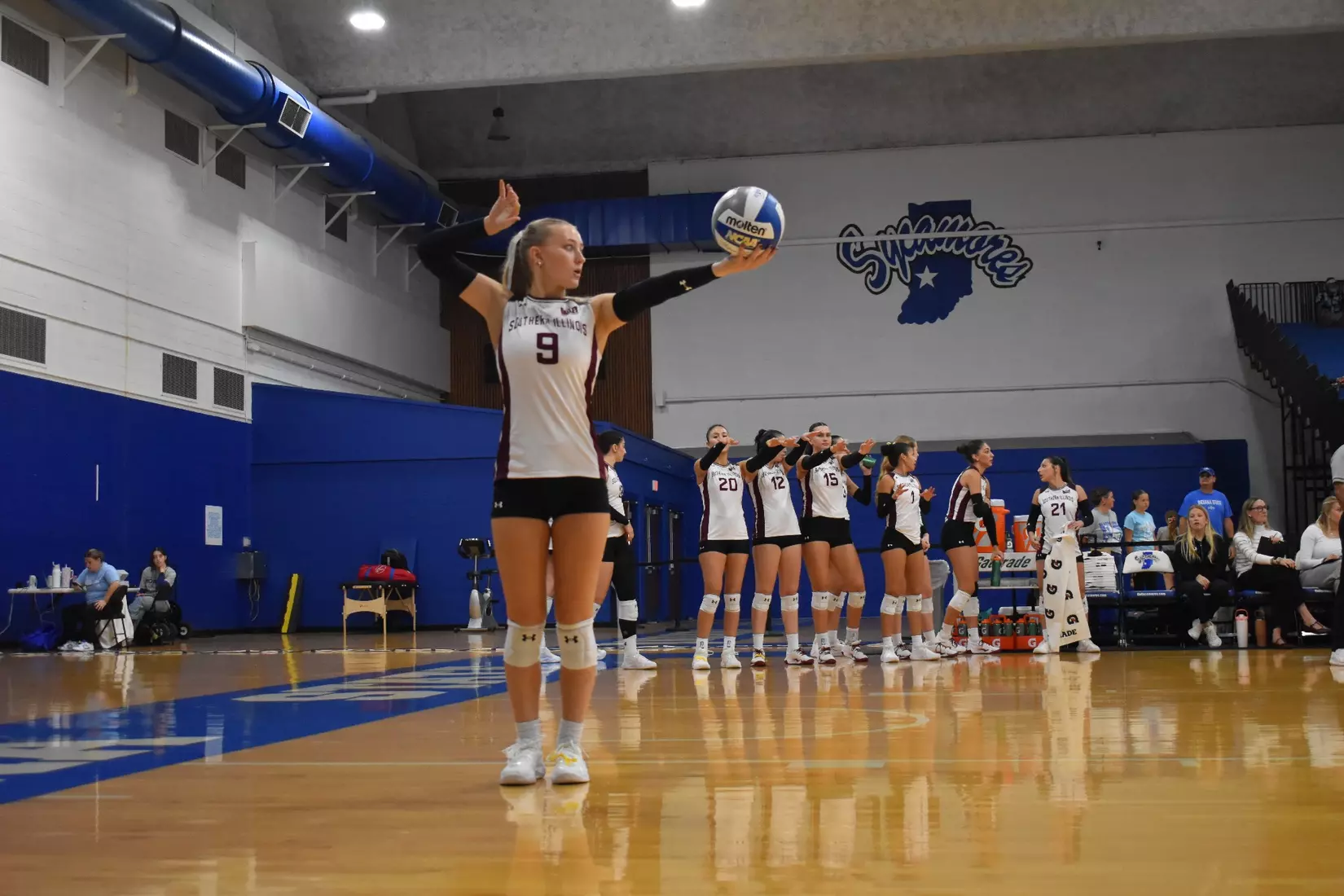 Lillian Dempkey prepares to serve a ball.