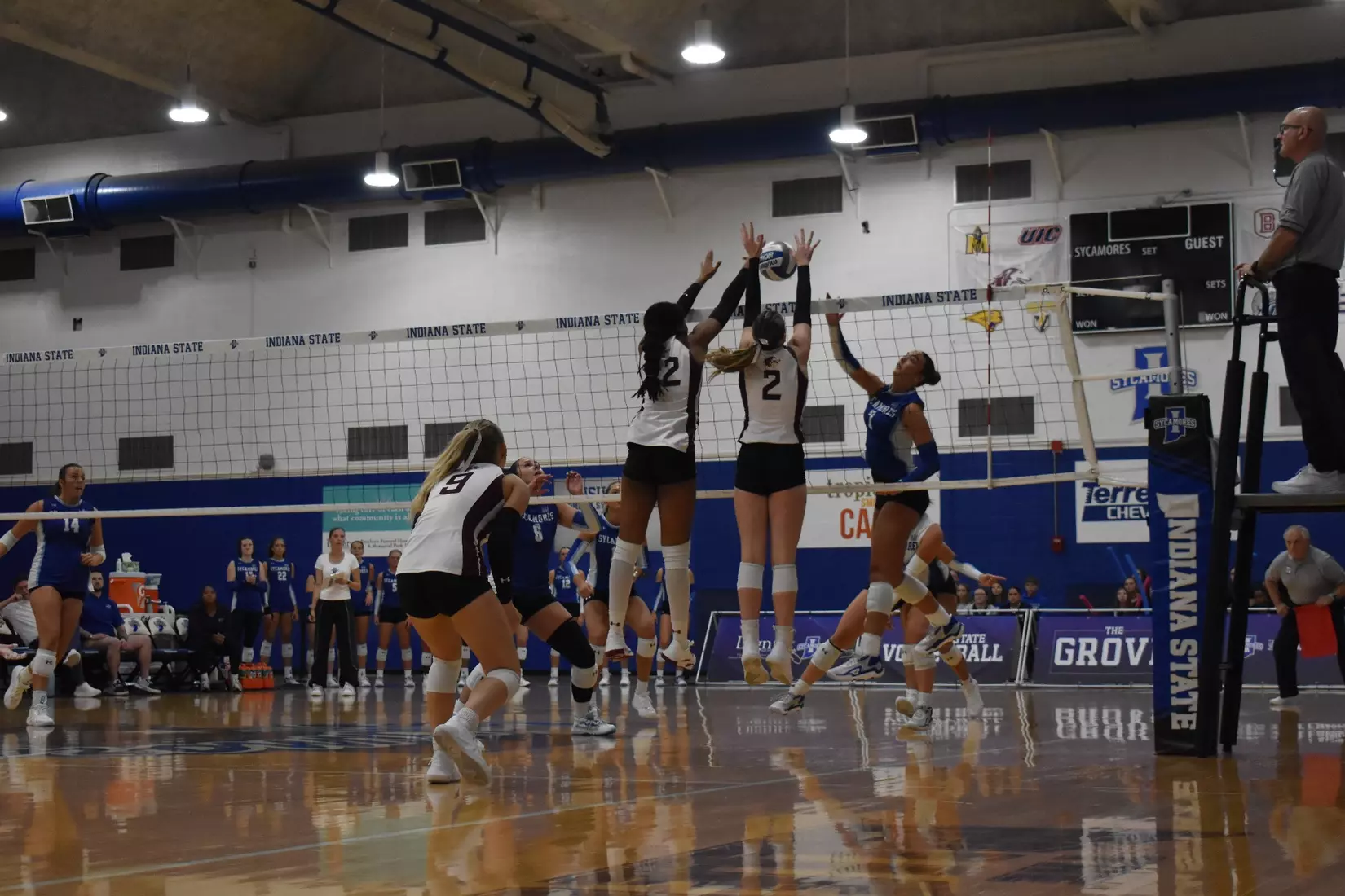 Chloe Anderson and Natalie Vance block a ball.