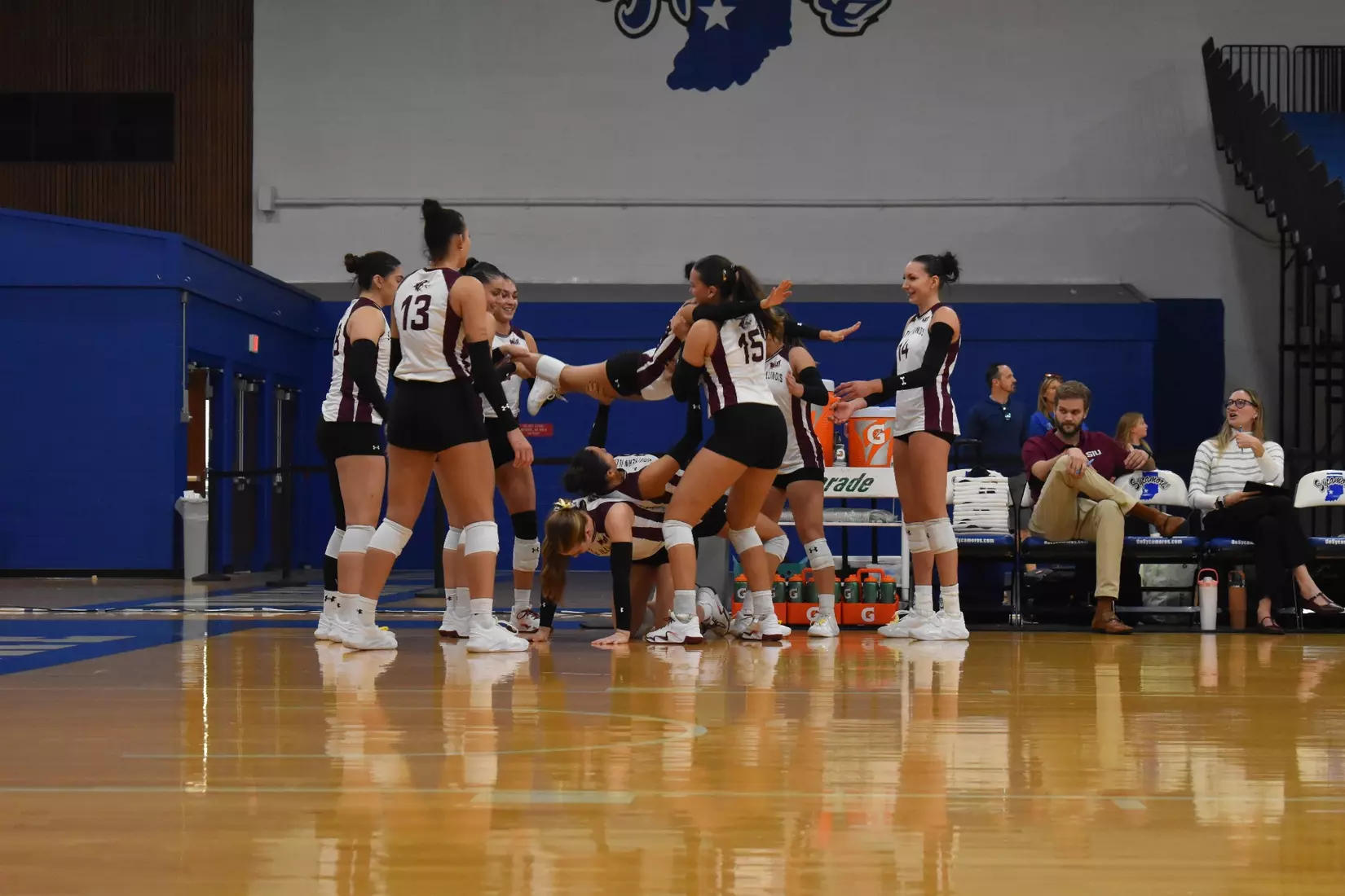 The bench does some bench presses with their players.