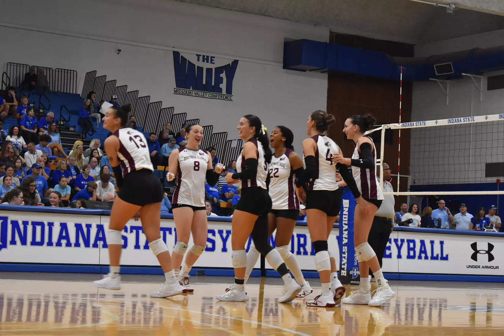 The team celebrates after a point.