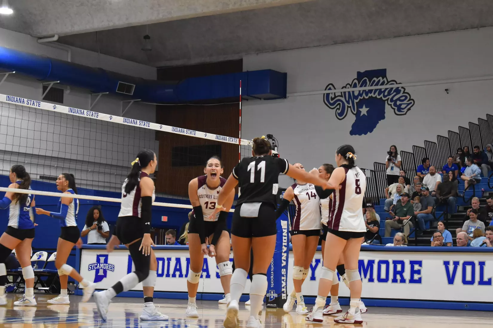 The team celebrates after a point.