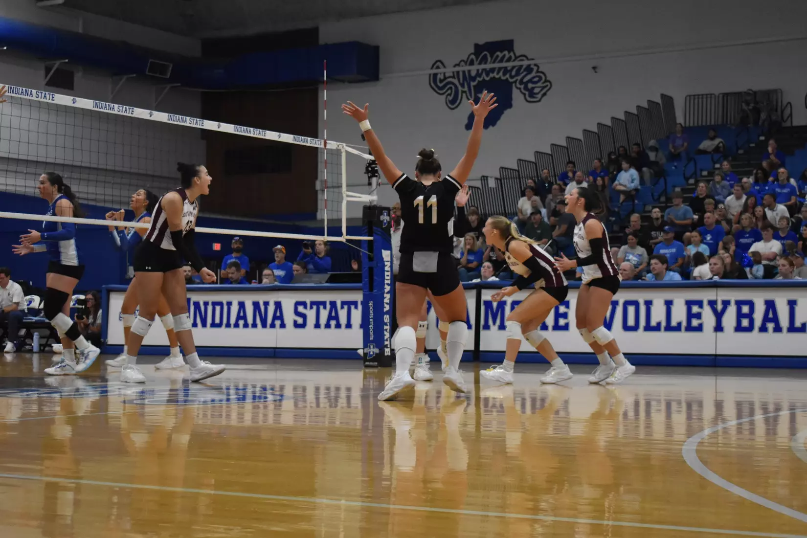 The team celebrates after a point.