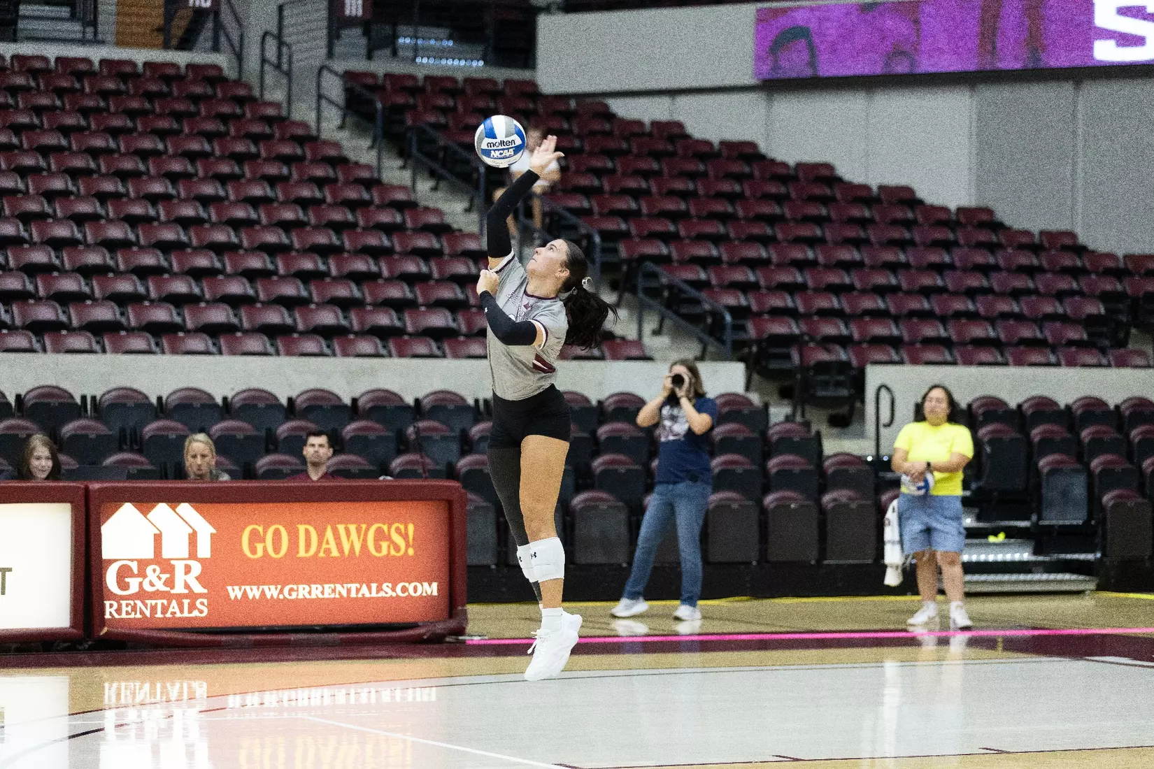McKenzie Moeller serves a ball in the match.