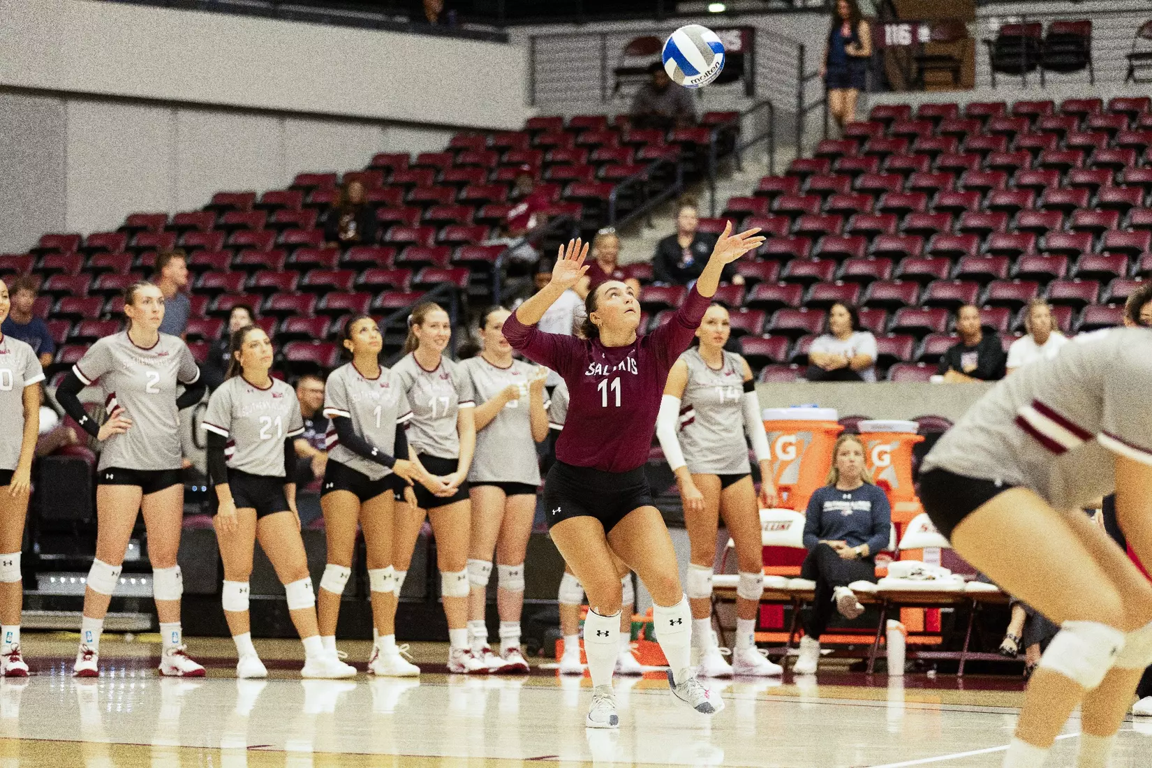 Jillian Shaneyfelt tosses the ball in the air prior to her serve.