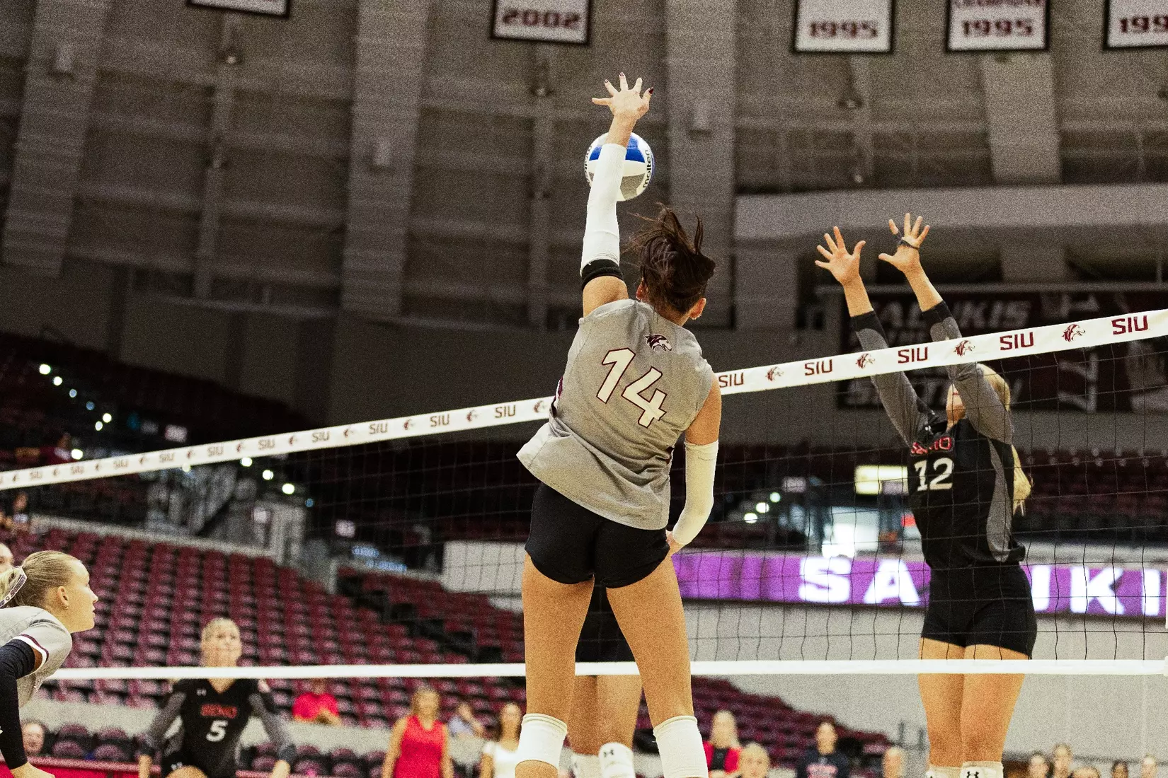 Ella Swansiger swings and attacks a ball.