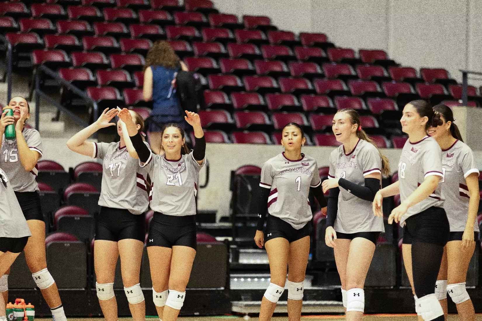 The bench celebrates and laughs after a point.