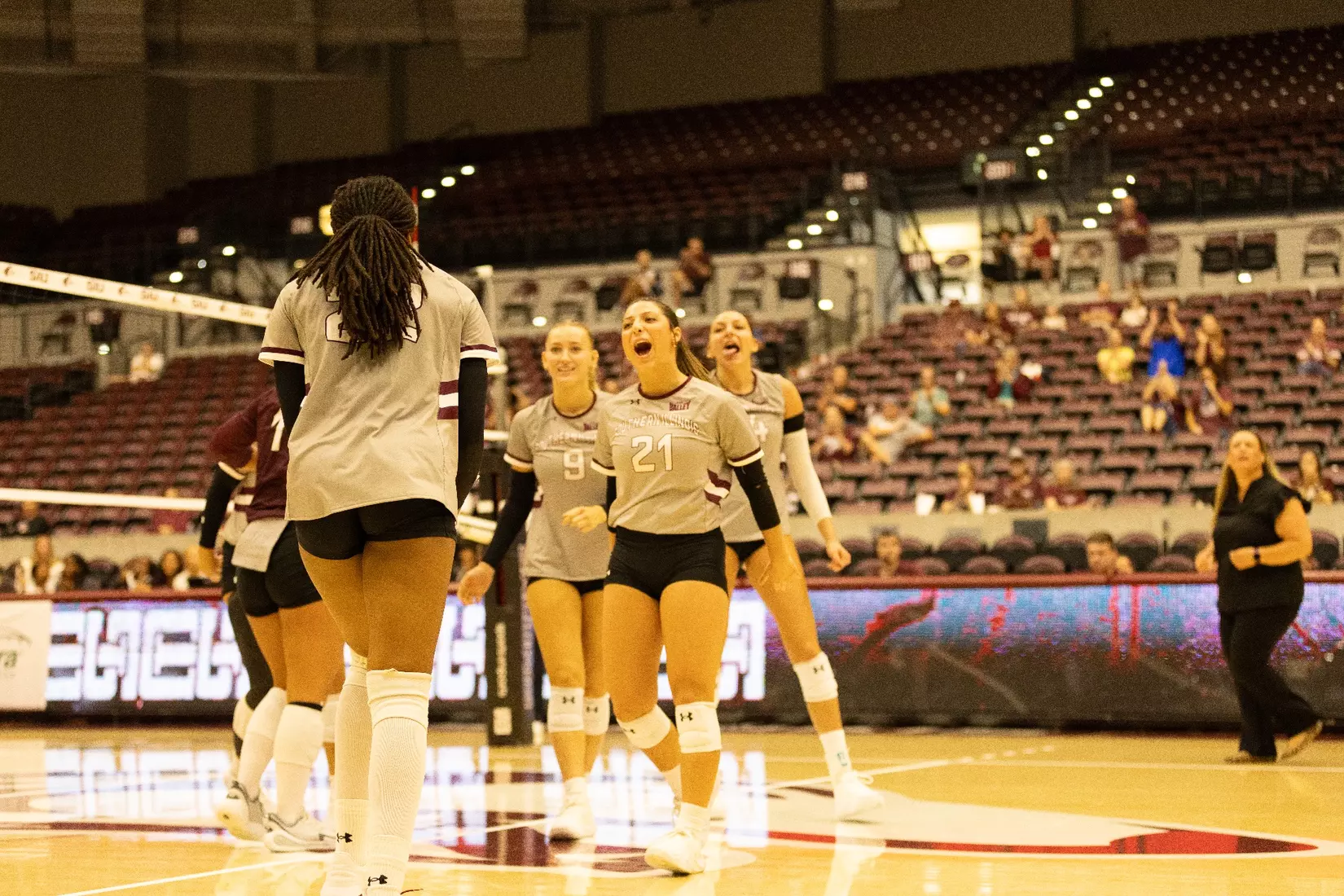 The team on the floor celebrates after a point.