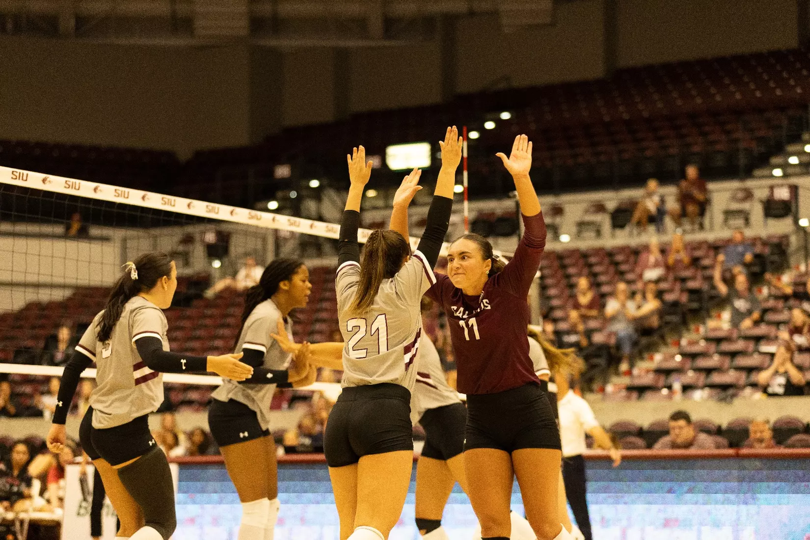 Jillain Shaneyfelt and Isabella Del Real double high five after a point.