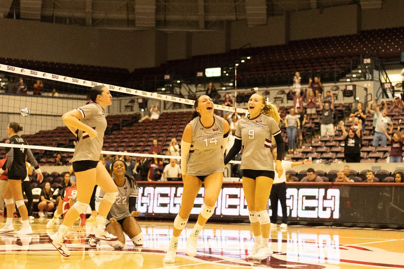 The team jumps and celebrates after winning the match.