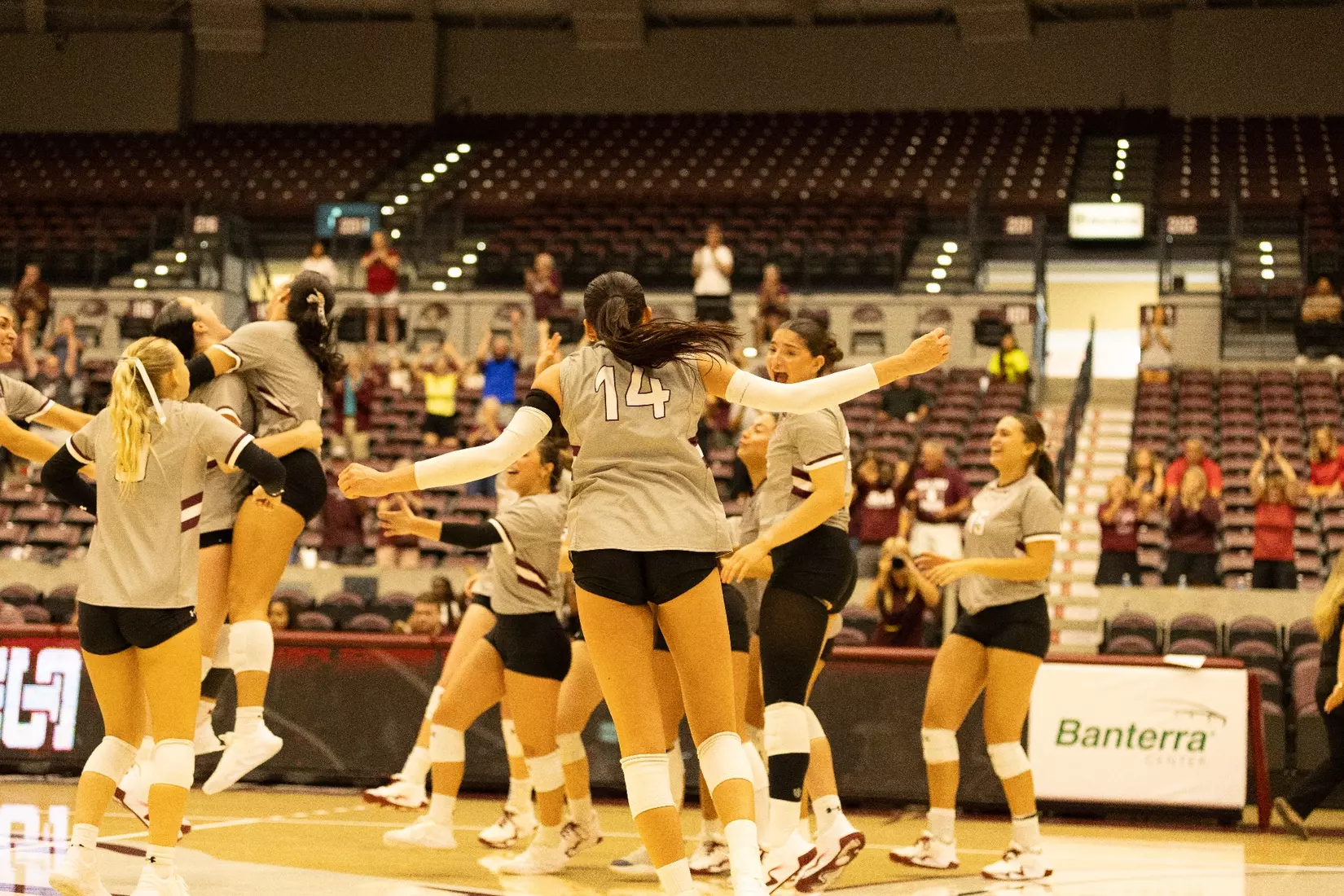 The team jumps and celebrates after winning the match.