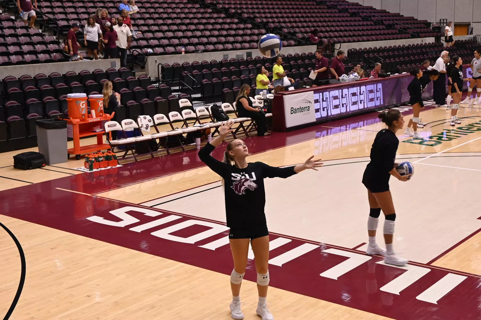 Lillian Dempkey prepares to hit a ball in warmups.