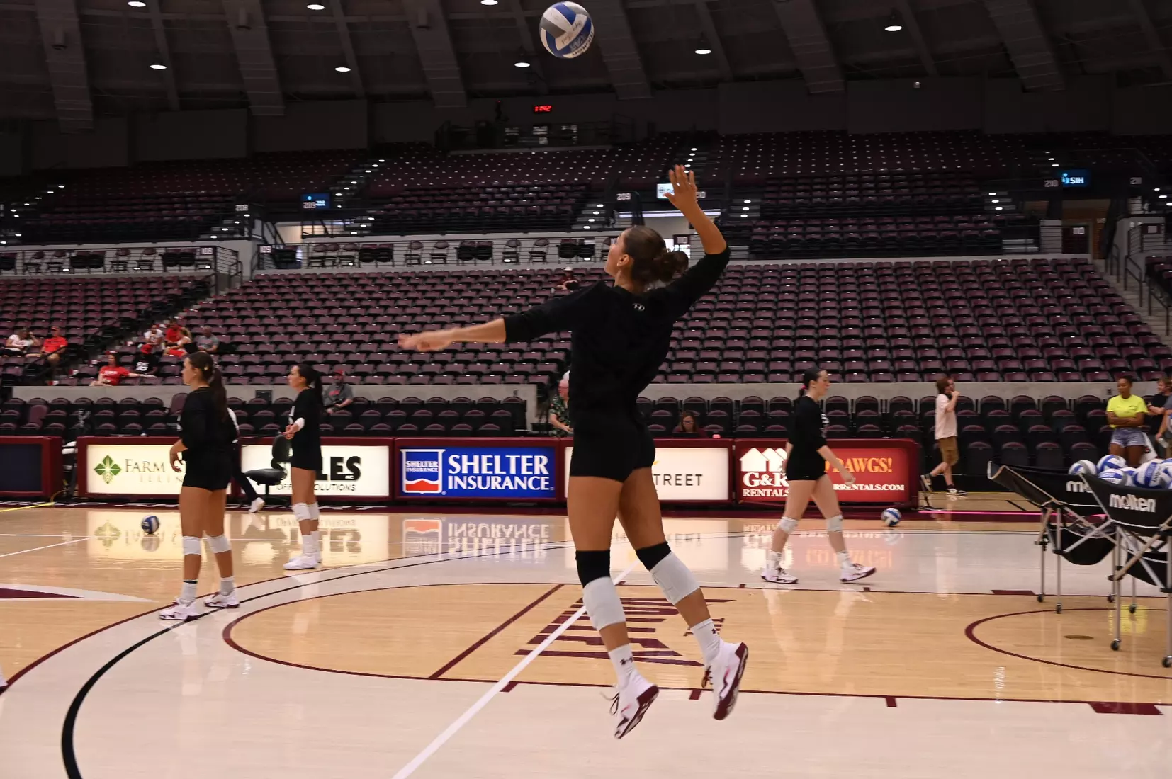 Ella McFarland jumps up for a serve.
