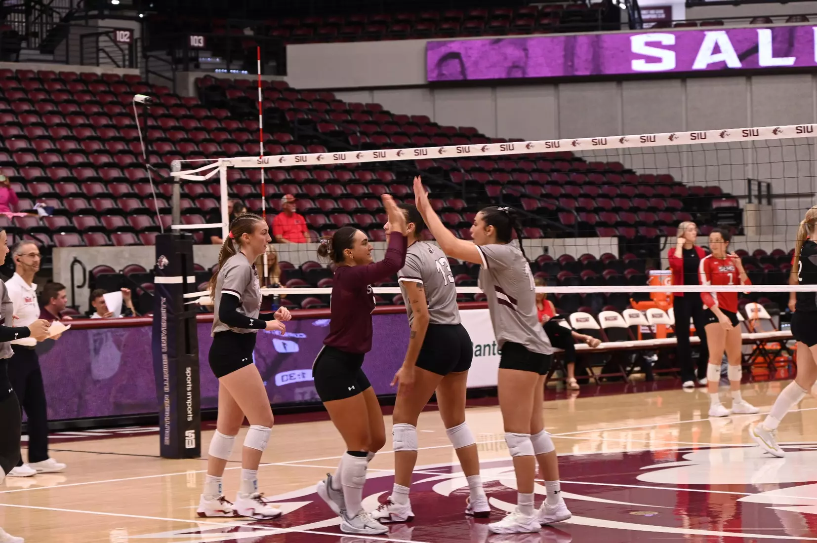 Jillian Shaneyfelt and Carlota Mora high five.
