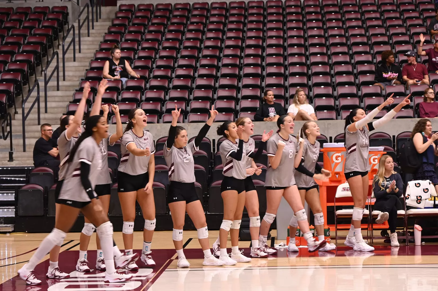 The bench celebrates after a point.