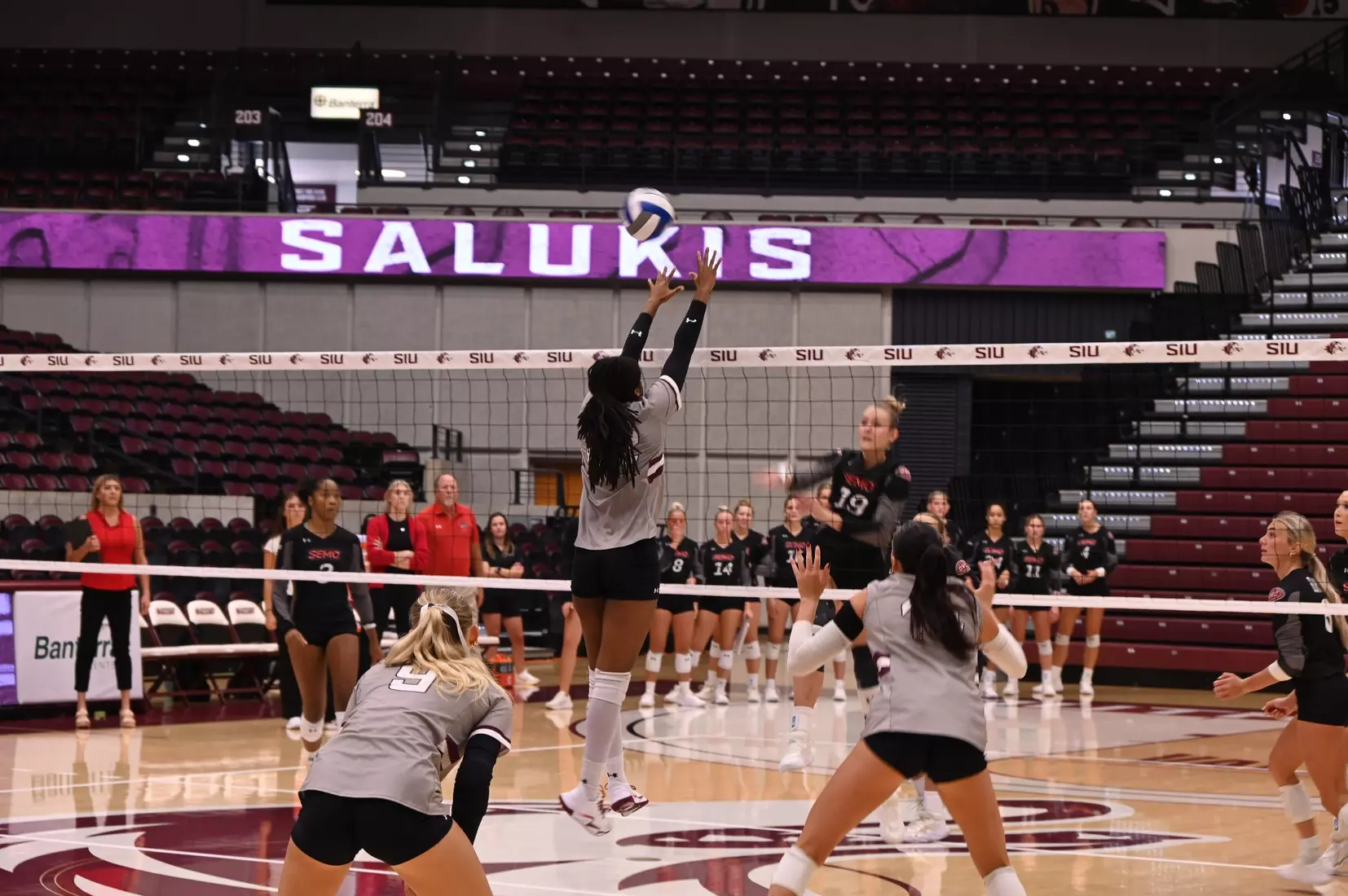 Chloe Anderson jumps up to block a ball.
