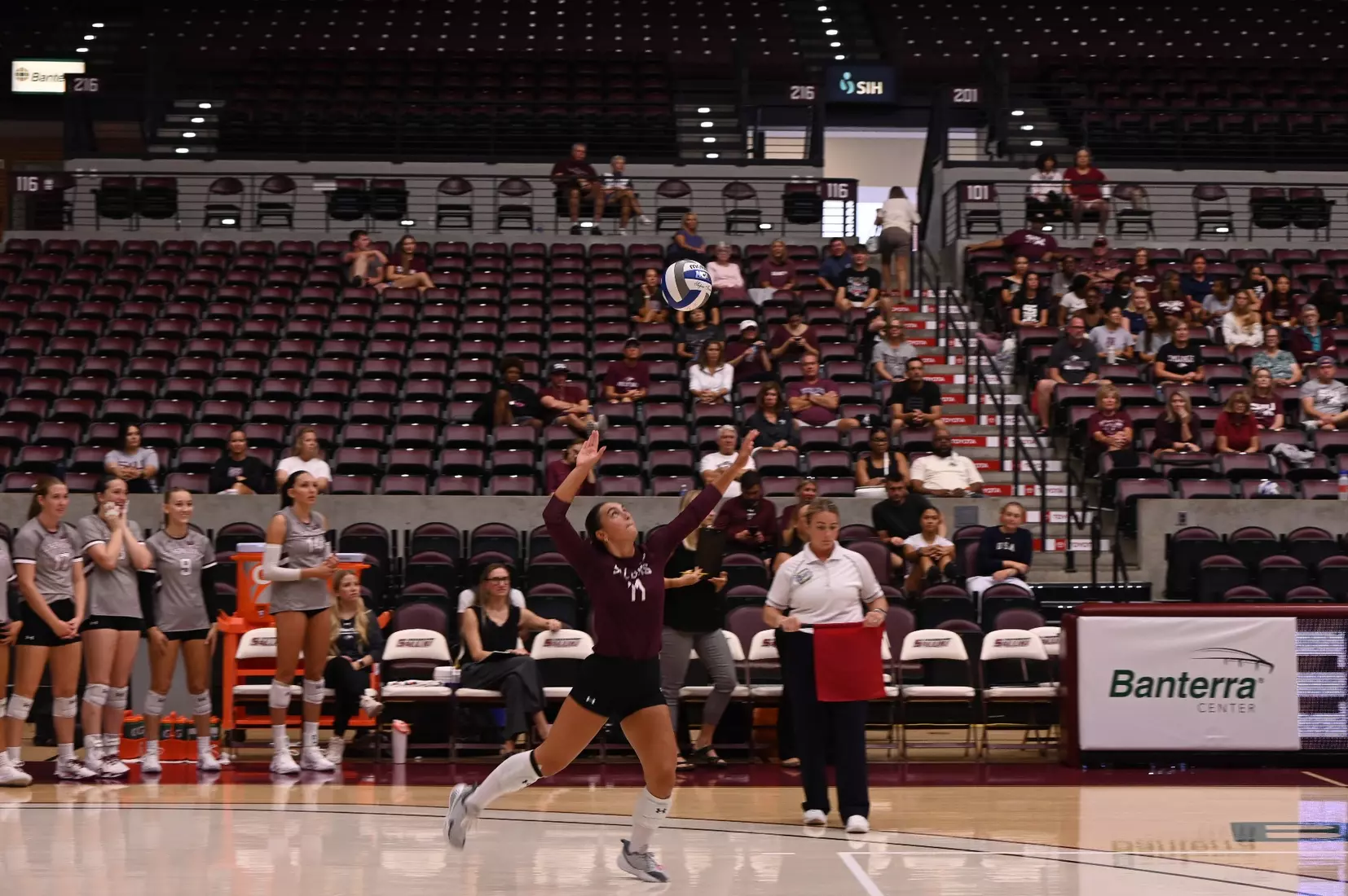 Jillian Shaneyfelt tosses a ball in the air prior to her serve.