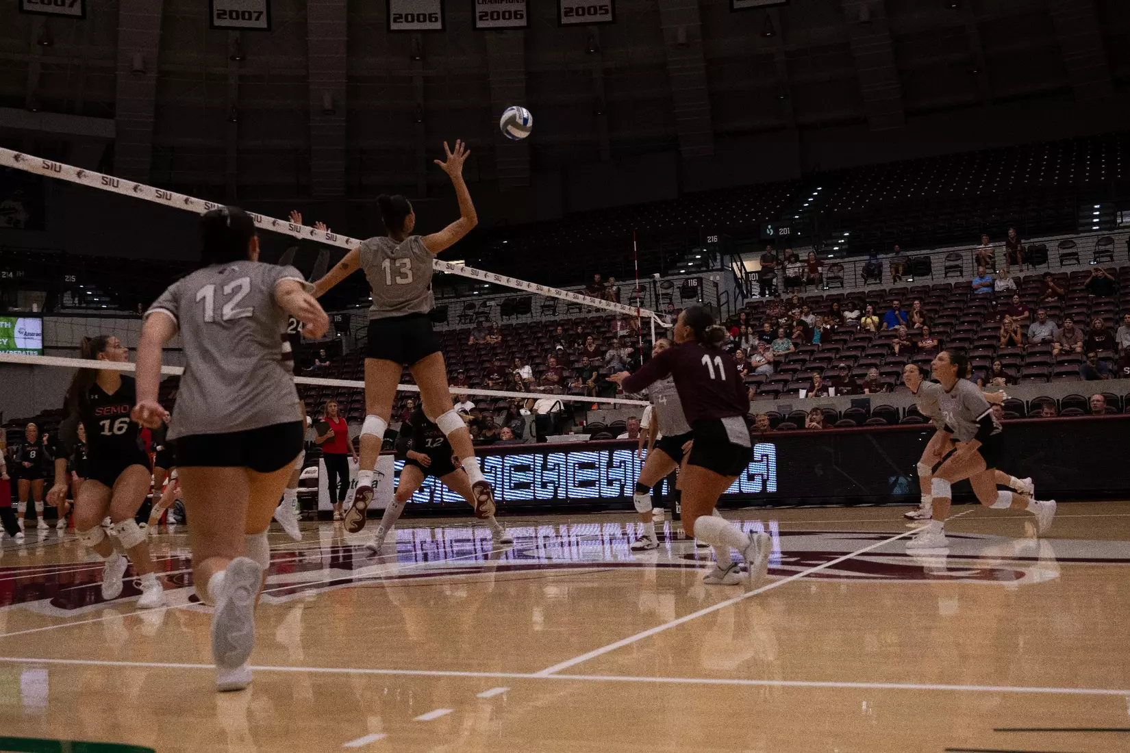 Beatriz Piaia swings her arm back to spike a ball.