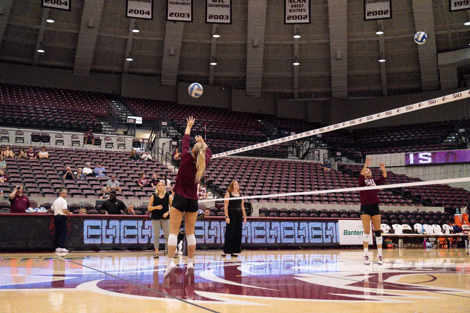 Lillian Dempkey sets a ball in warmups.