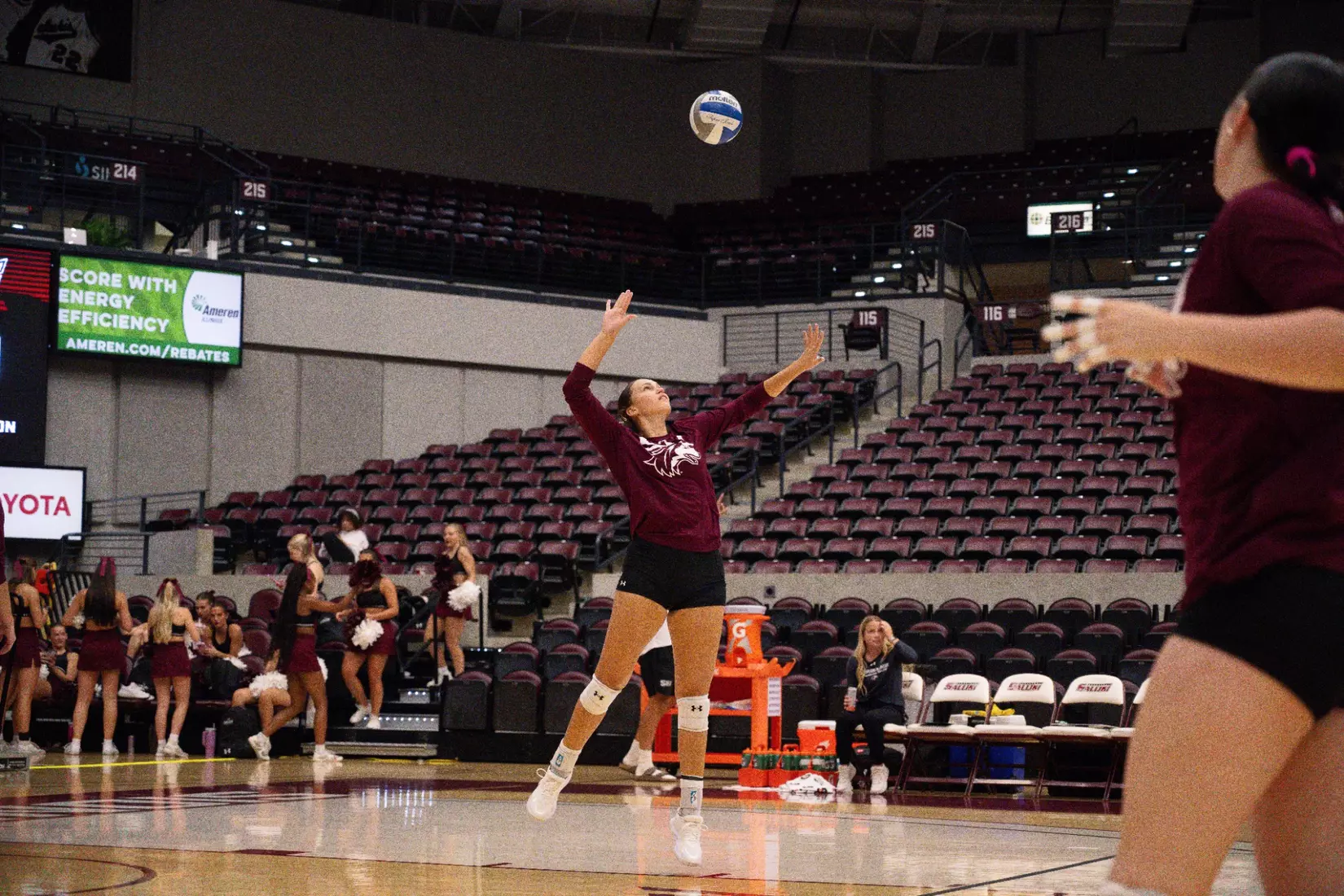 Ida Almkvist serves a ball in warmups.