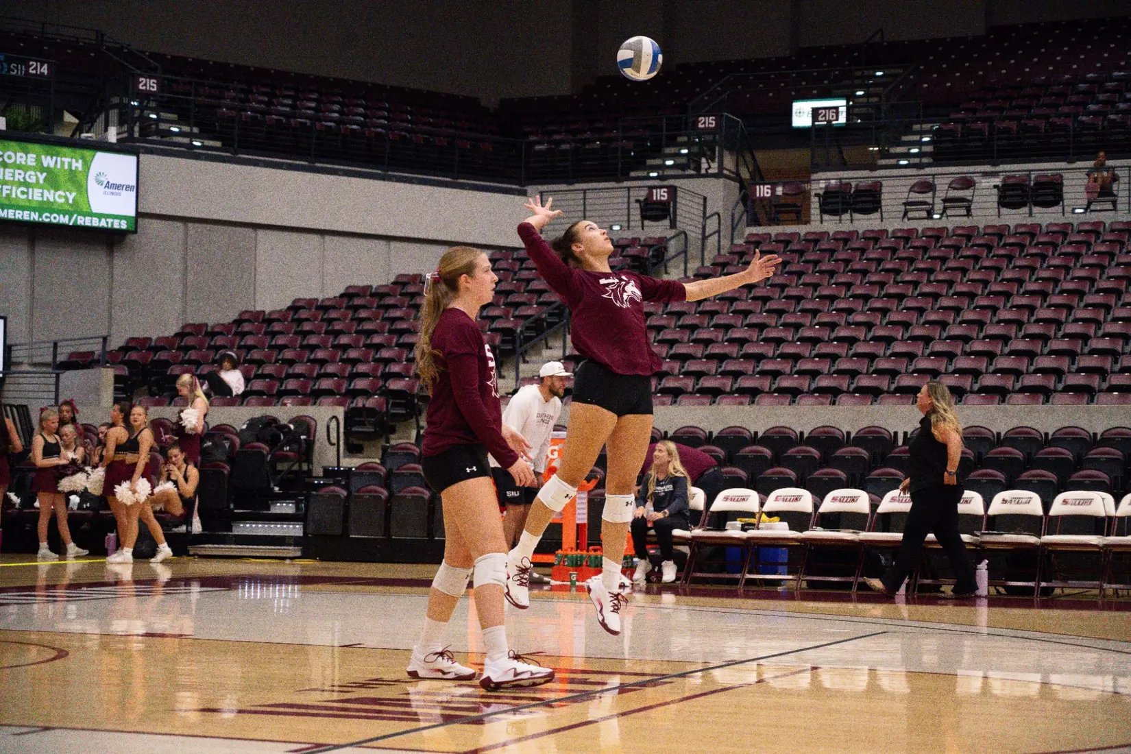 Beatriz Piaia serves a ball in warmups.