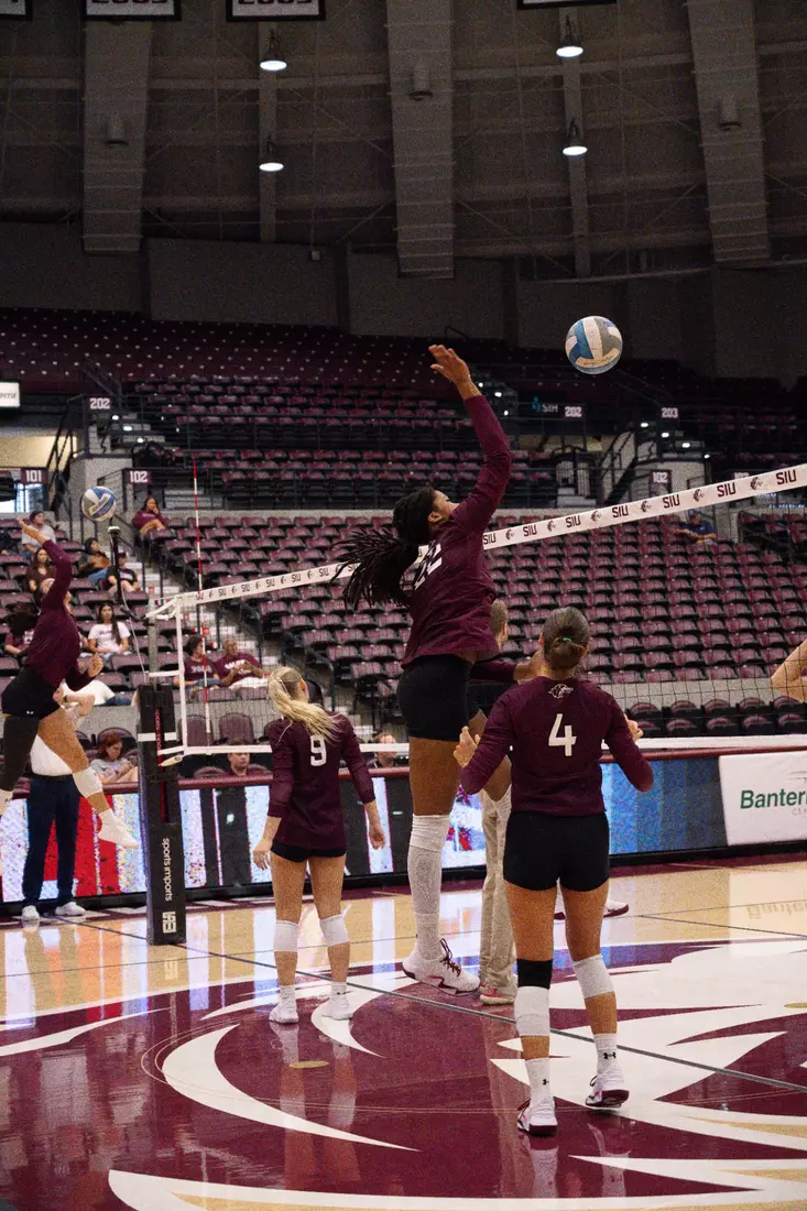 Chloe Anderson spikes a ball in warmups.