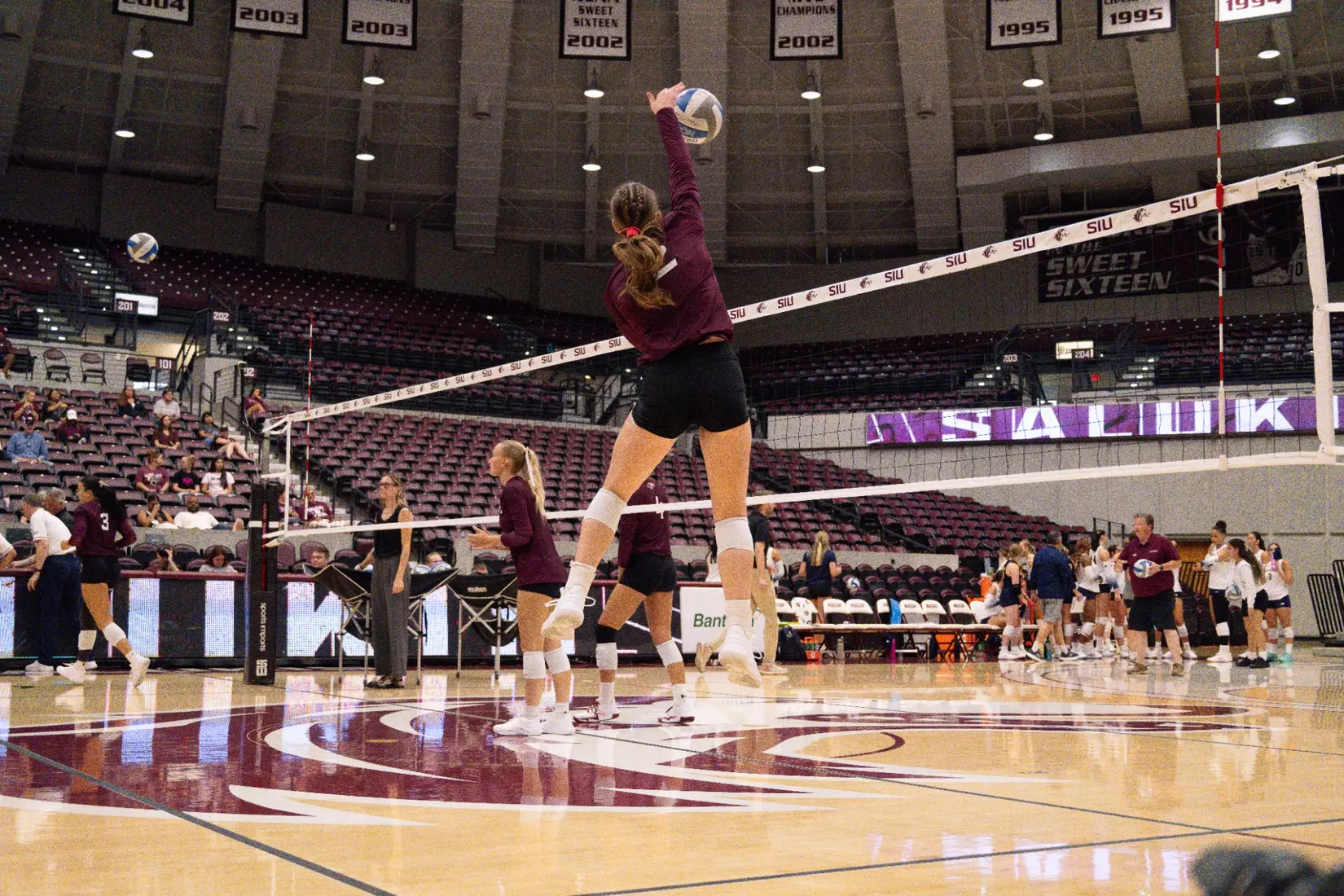 Natalie Vance spikes a ball in warmups.