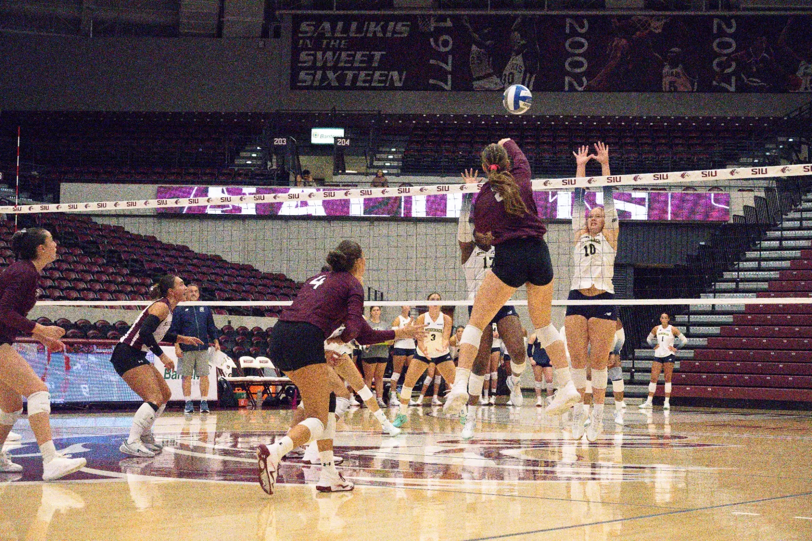 Natalie Vance spikes a ball in the match.