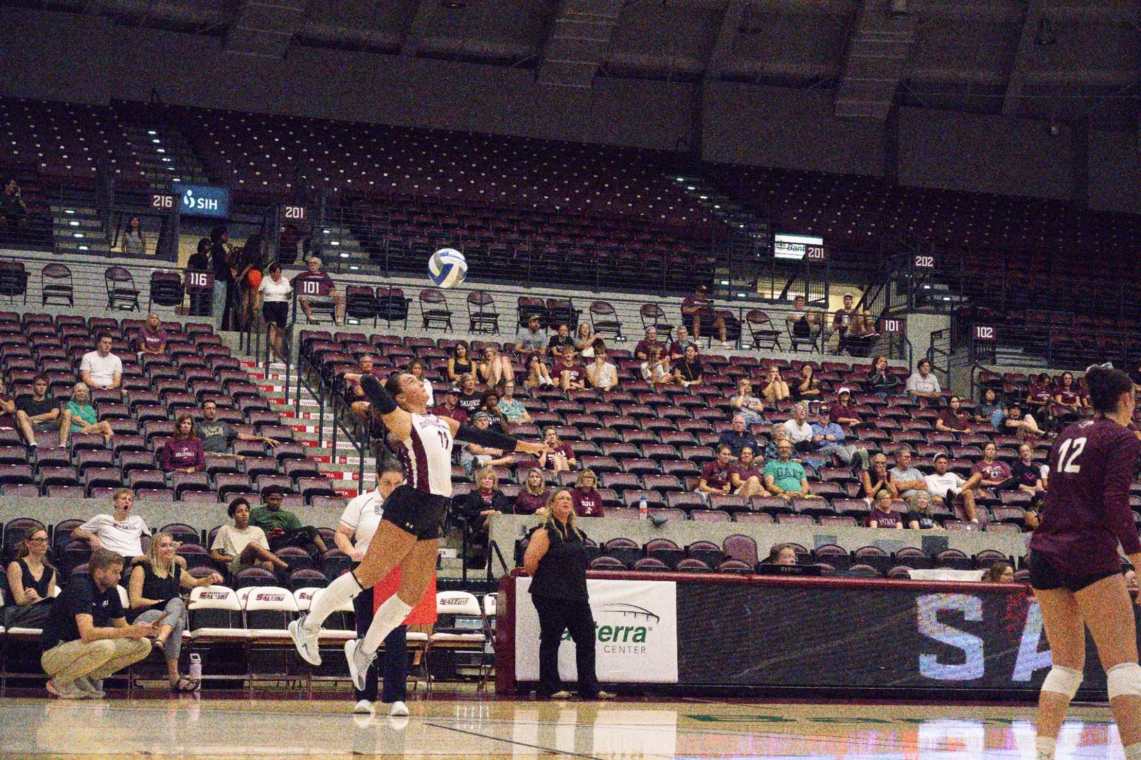 Jillian Shaneyfelt tosses a ball in the air prior to her serve.