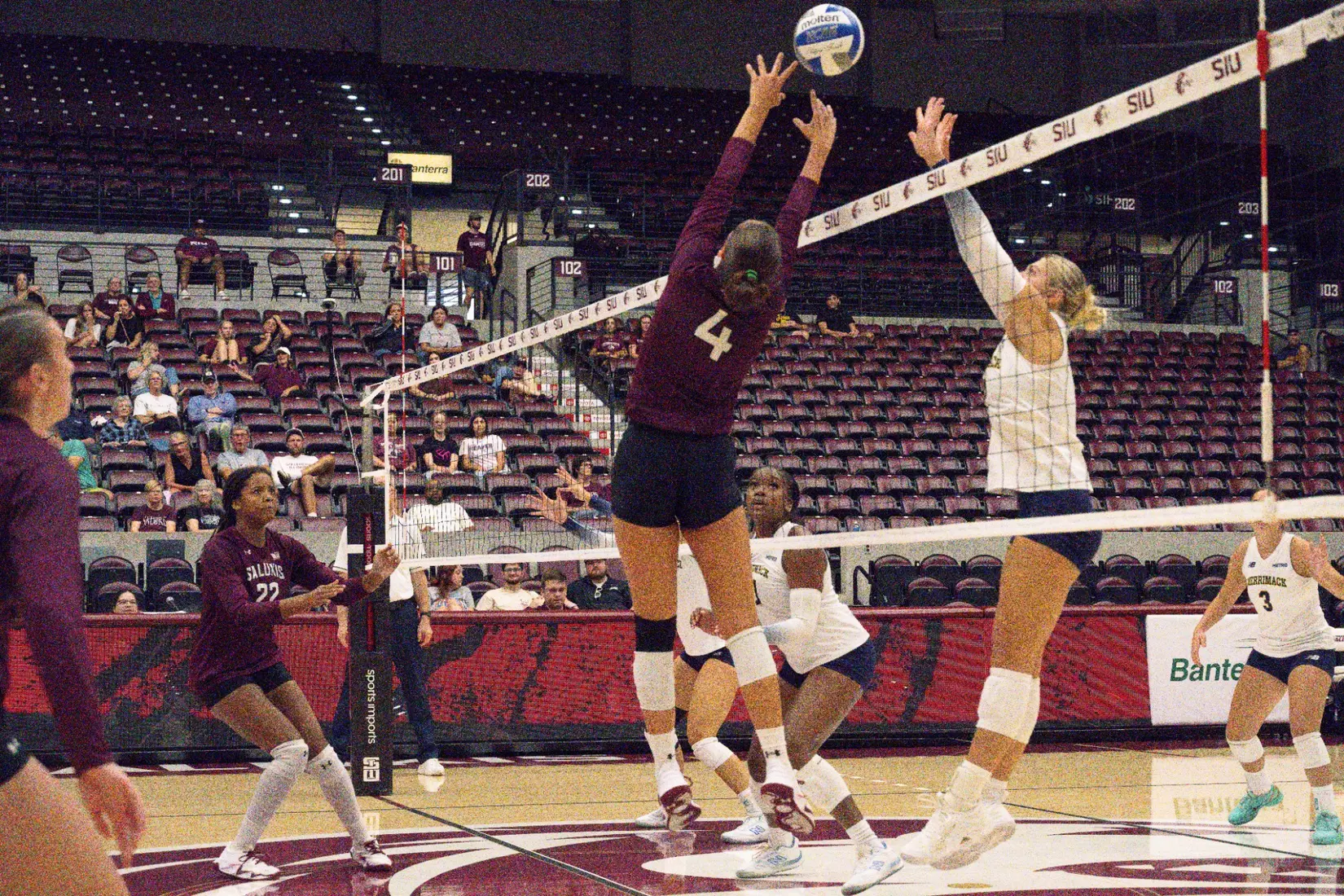 Ella McFarland sets a ball over the net.