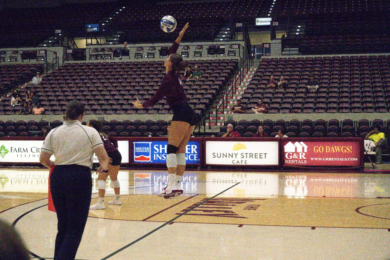 Ella McFarland serves a ball in the match.