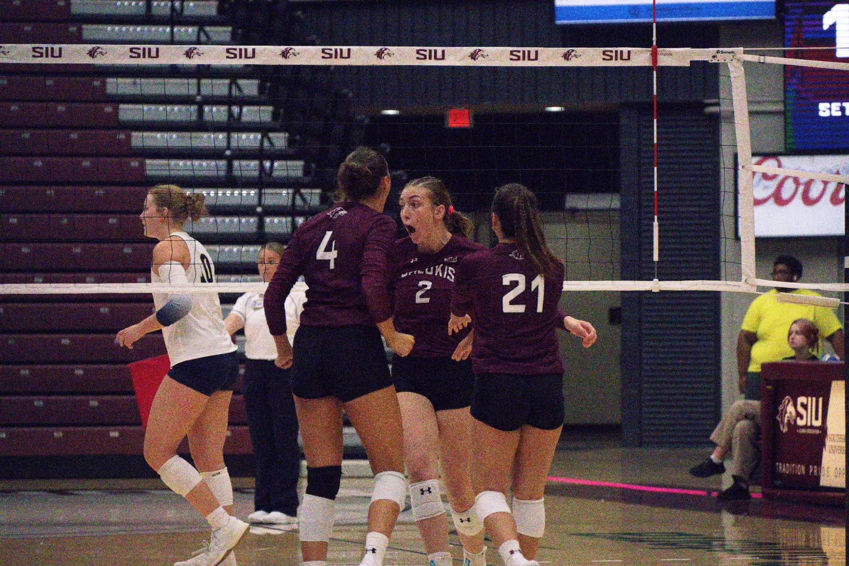 Natalie Vance celebrates with Ella McFarland and Isabella Del Real.