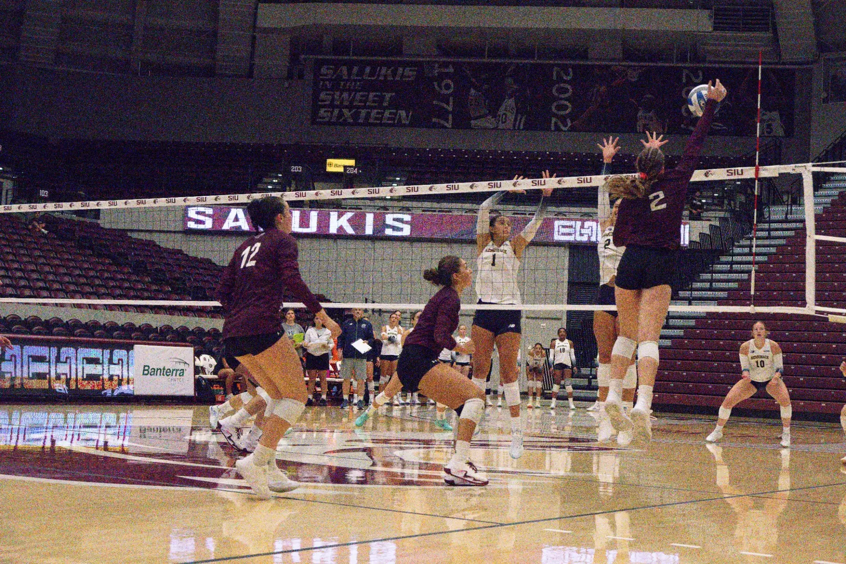 Natalie Vance spikes a ball in the match.