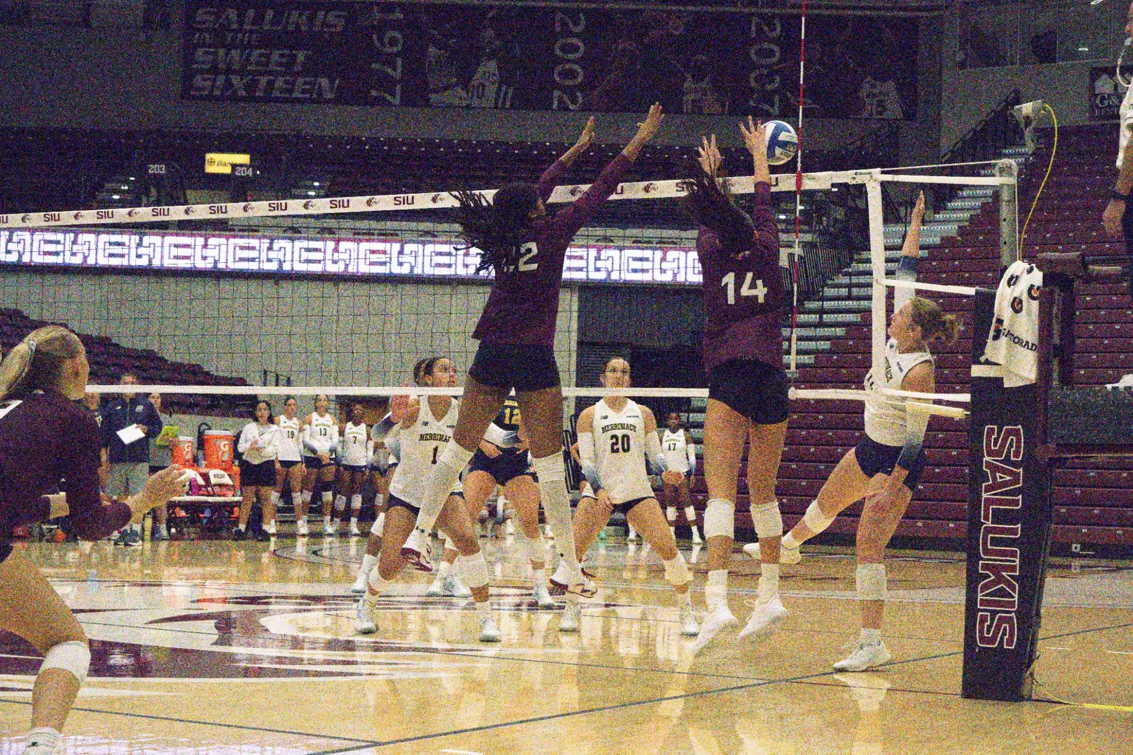 Chloe Anderson and Ella Swansiger go up for a tandem block.