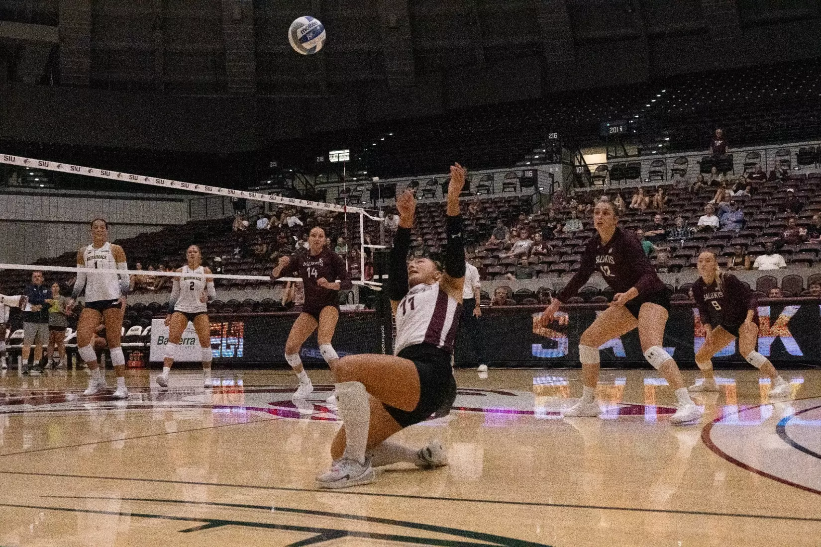 Jillian Shaneyfelt lays out for a ball as she bumps it.