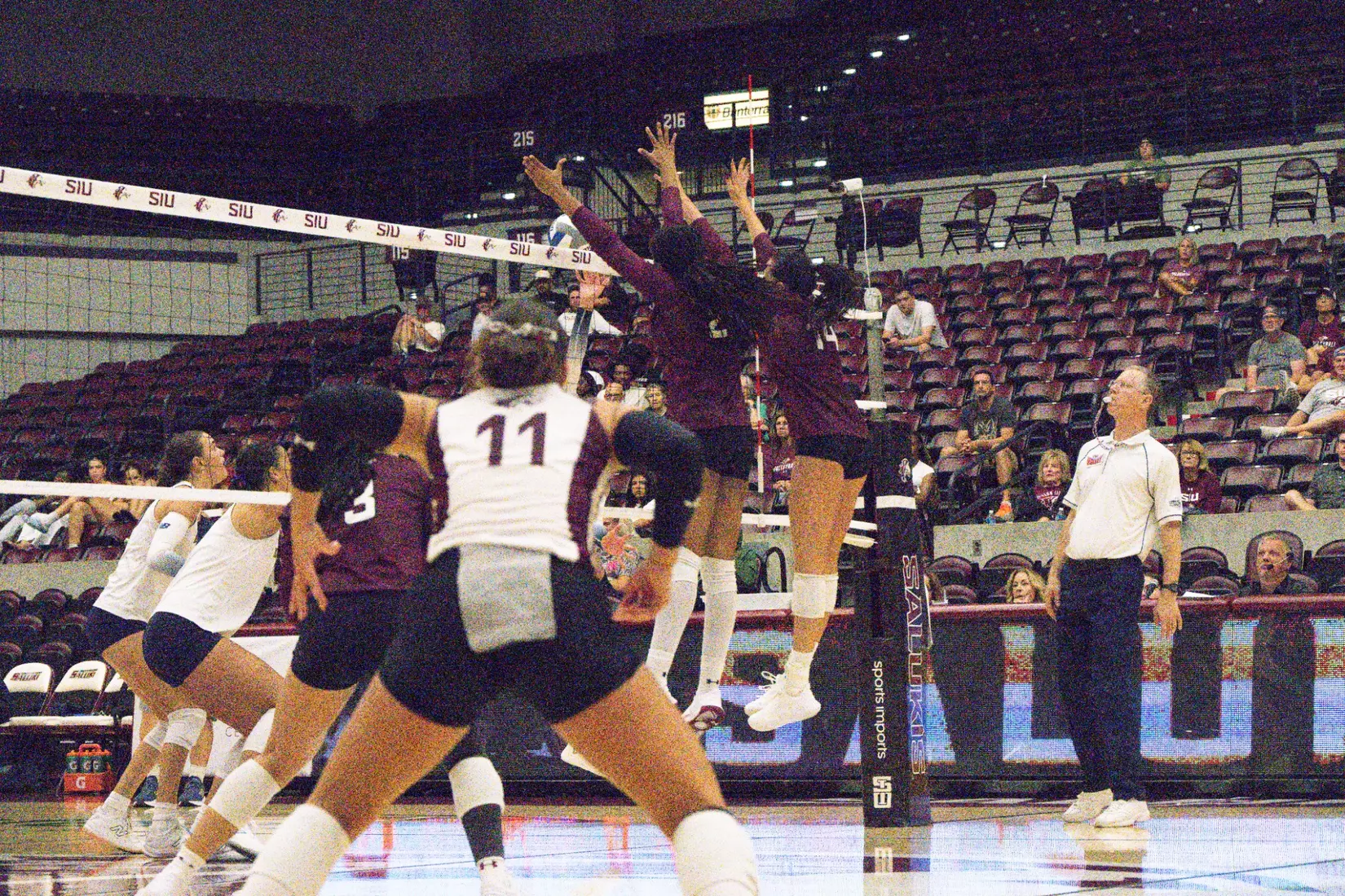 Chloe Anderson and Ella Swansiger block a ball.
