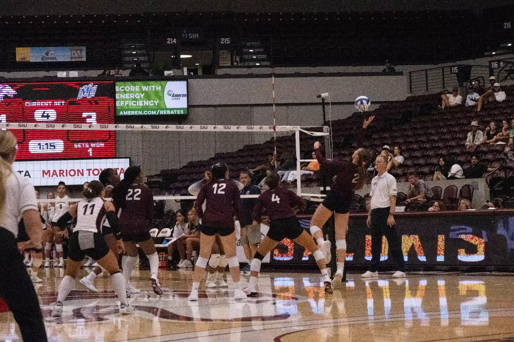 Natalie Vance tips a ball over the net.