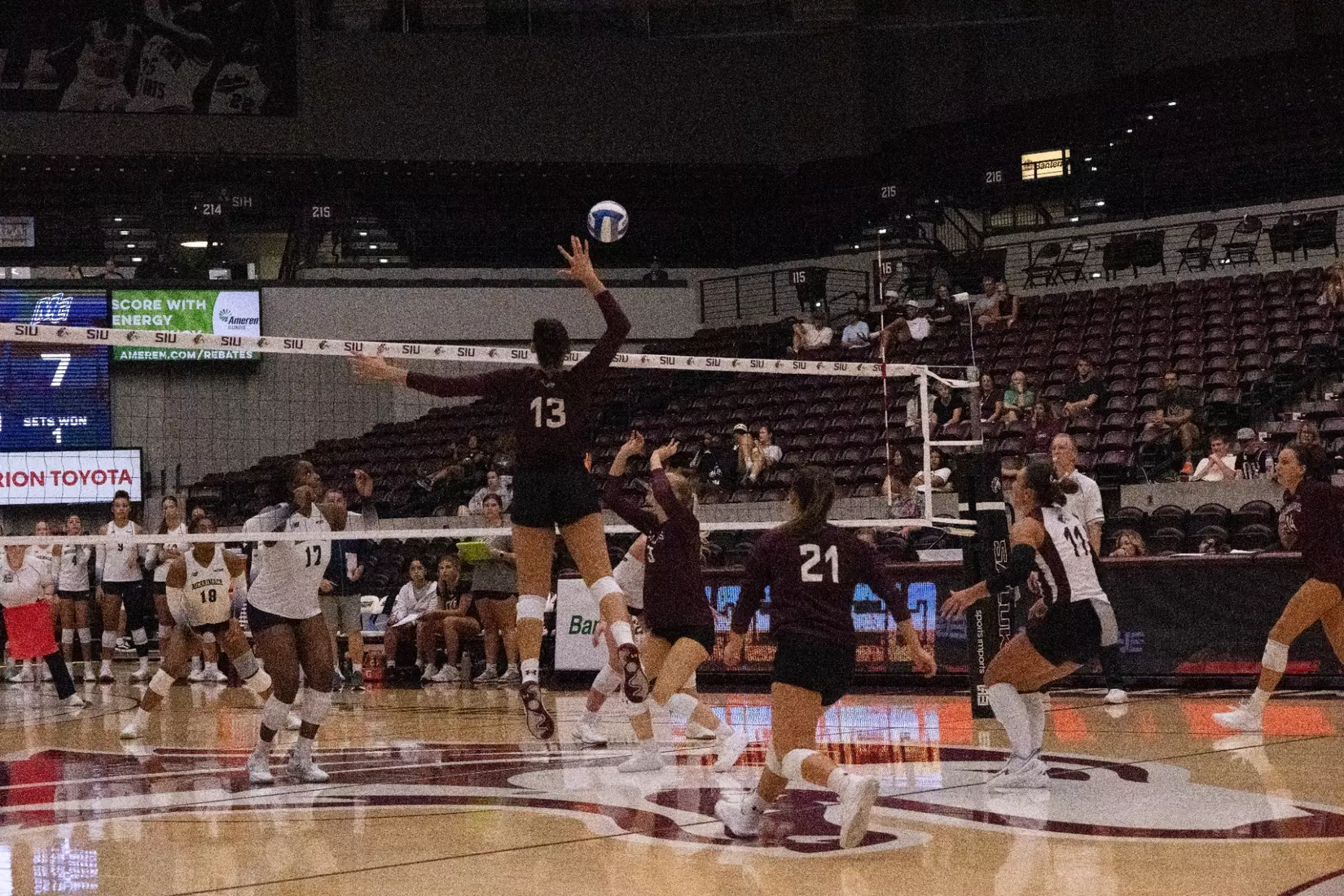 Beatriz Piaia swings her arm back to spike a ball.