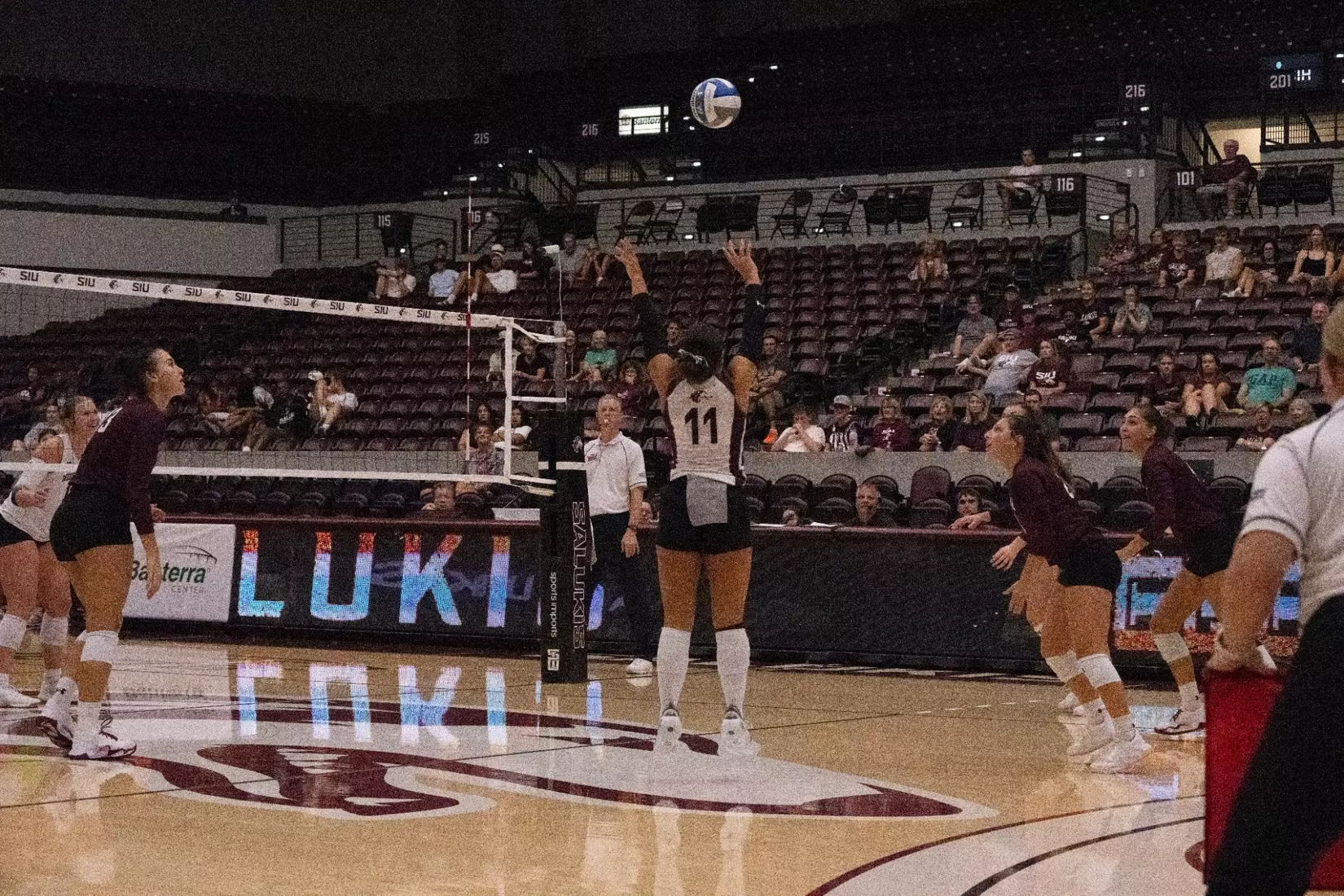 Jillian Shaneyfelt jumps as she sets a ball.