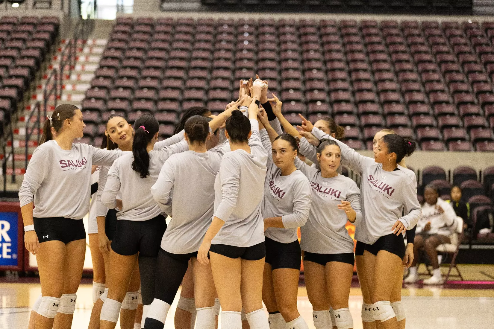 The team huddles during warmups.