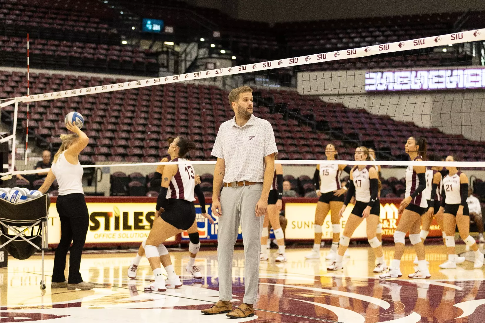 Assistant Coach Chris Yates looks on during warmups.